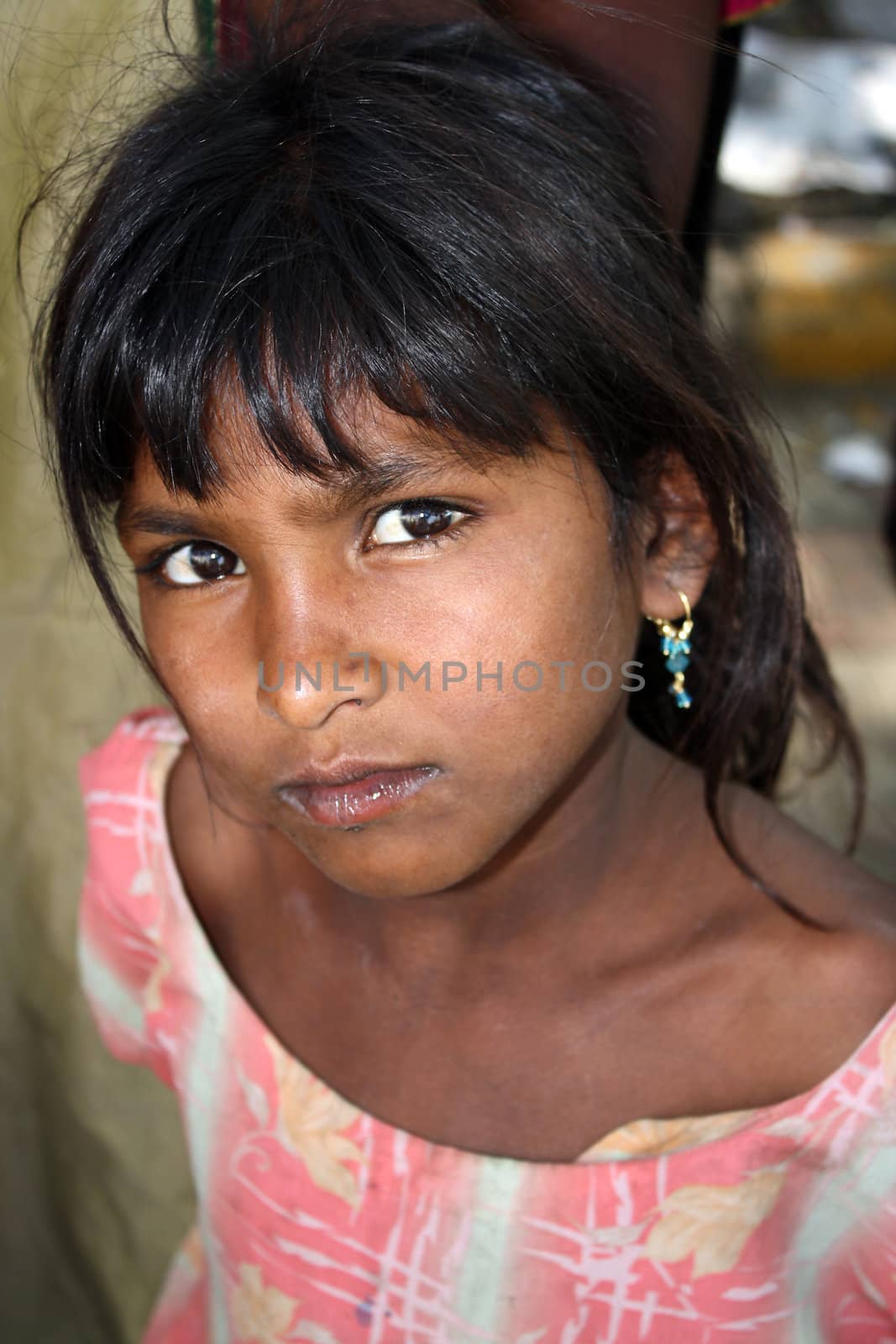A portrait of a poor girl from India.