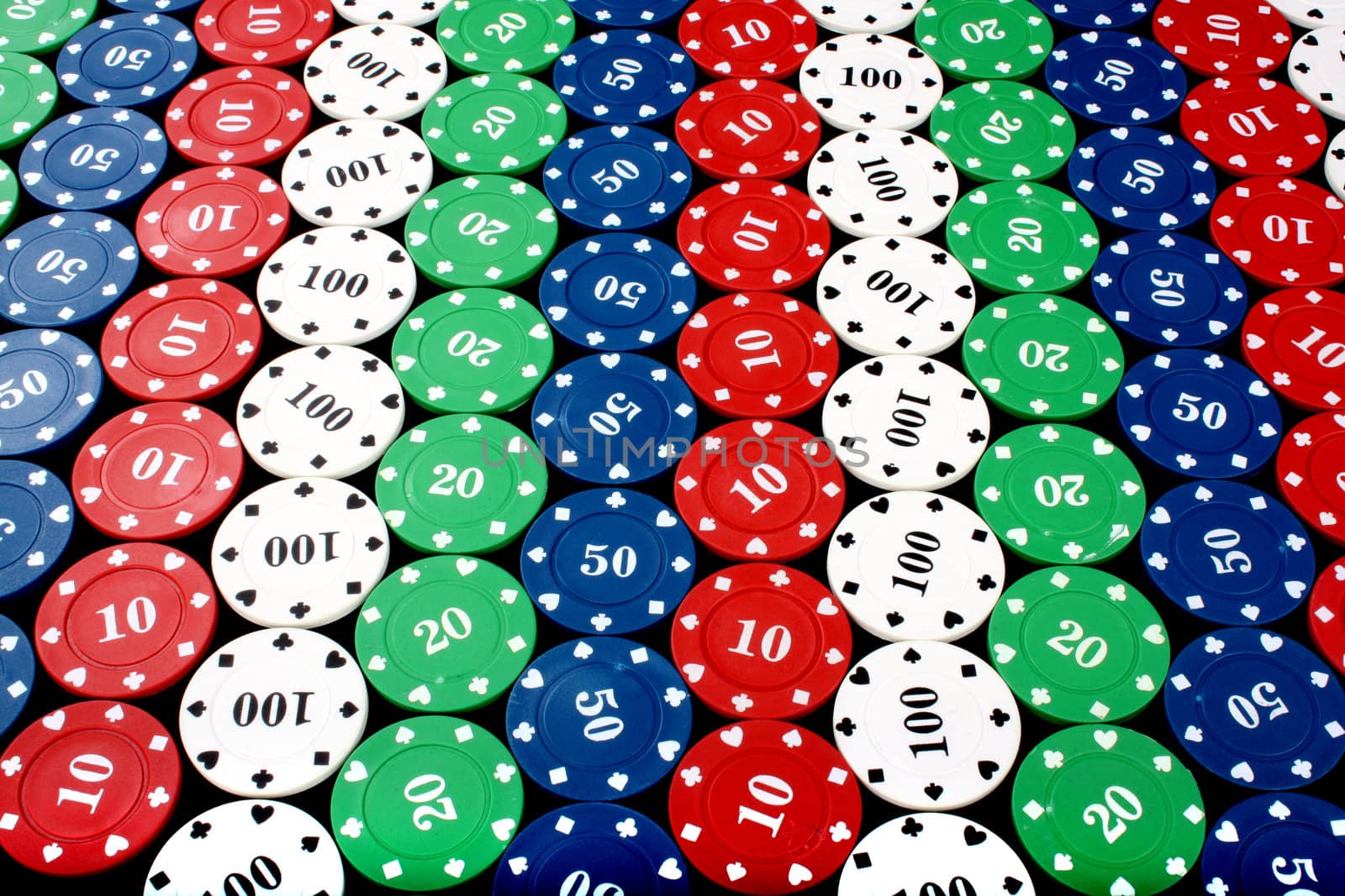 A background of colorful casino chips in a diagonal pattern.