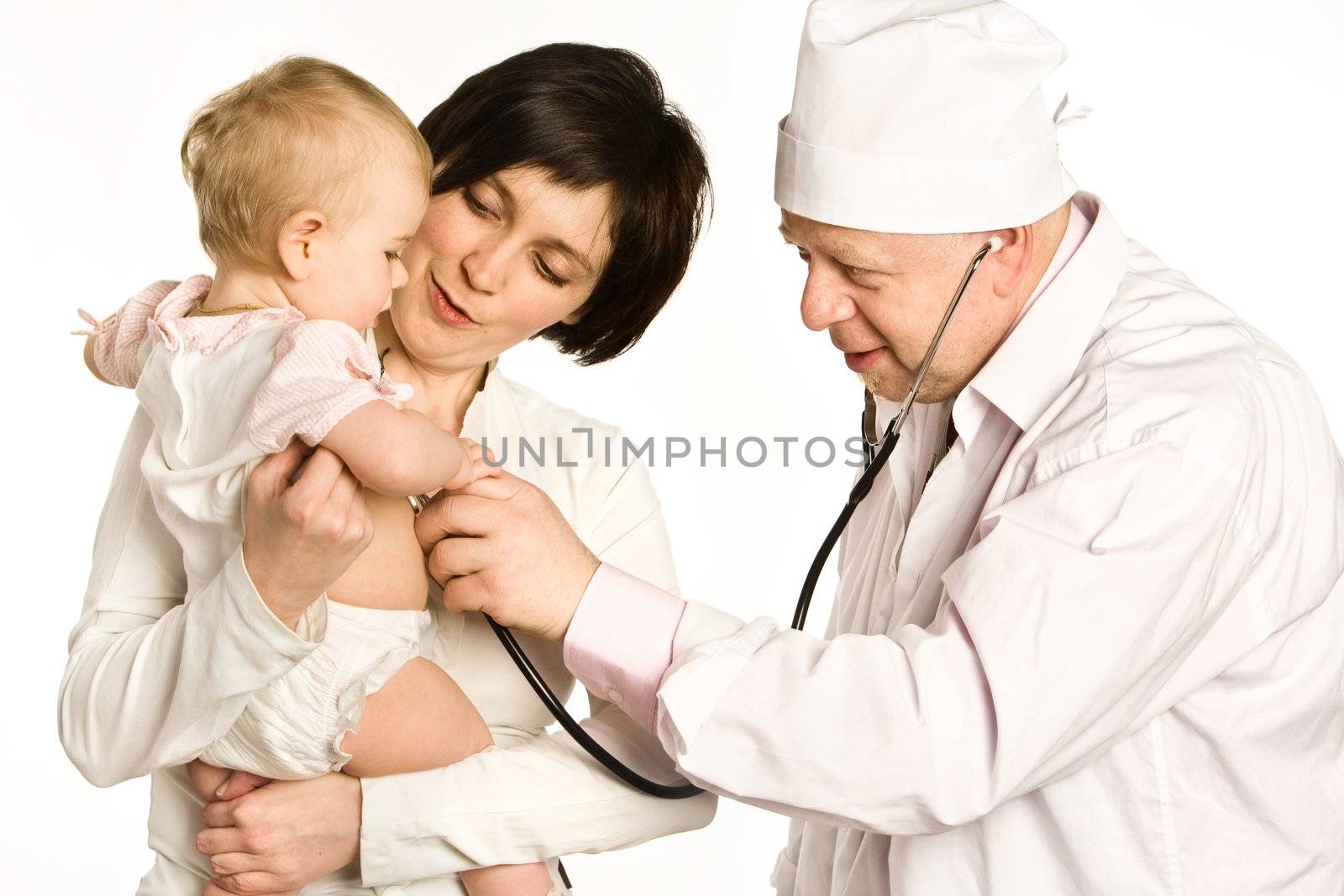 Mother with the little girl on hands stands near to the doctor