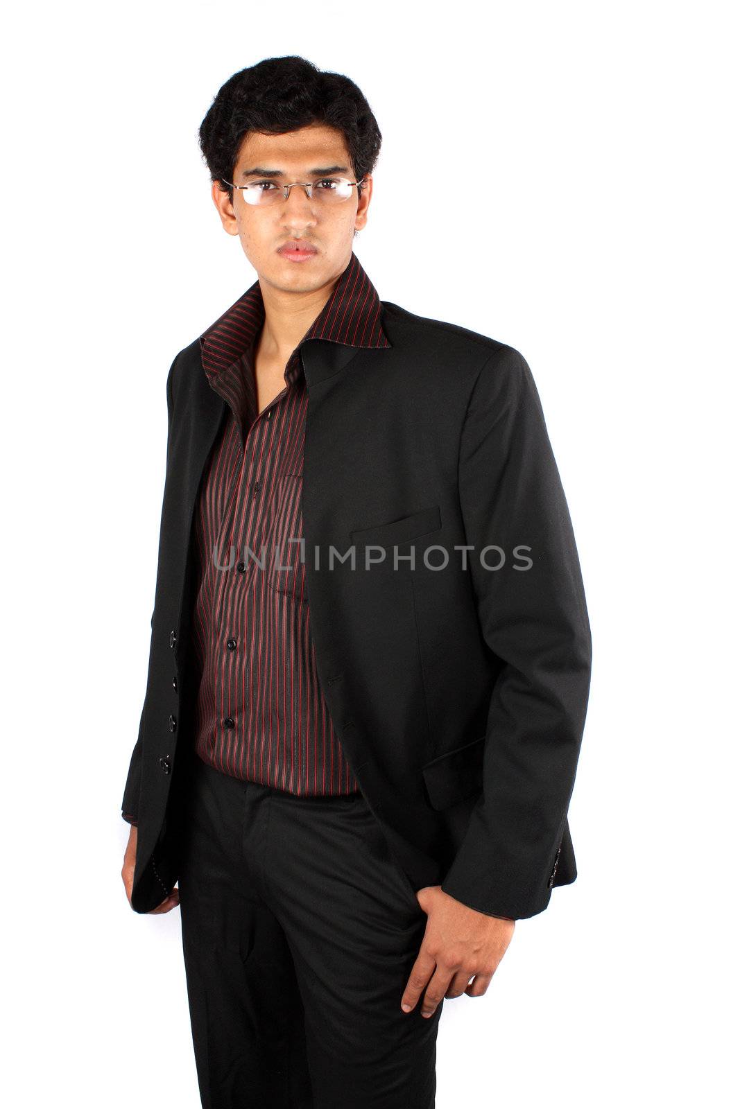 A portrait of a handsome young Indian business manager, on white studio background.