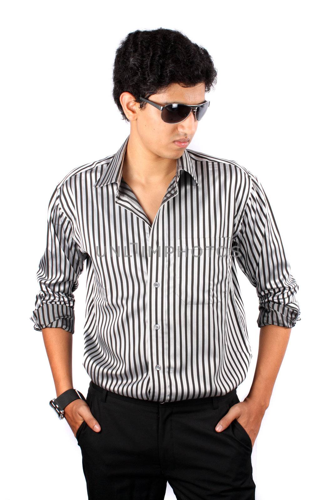 A portrait of a smart Indian guy wearing sunglasses, on white studio background.