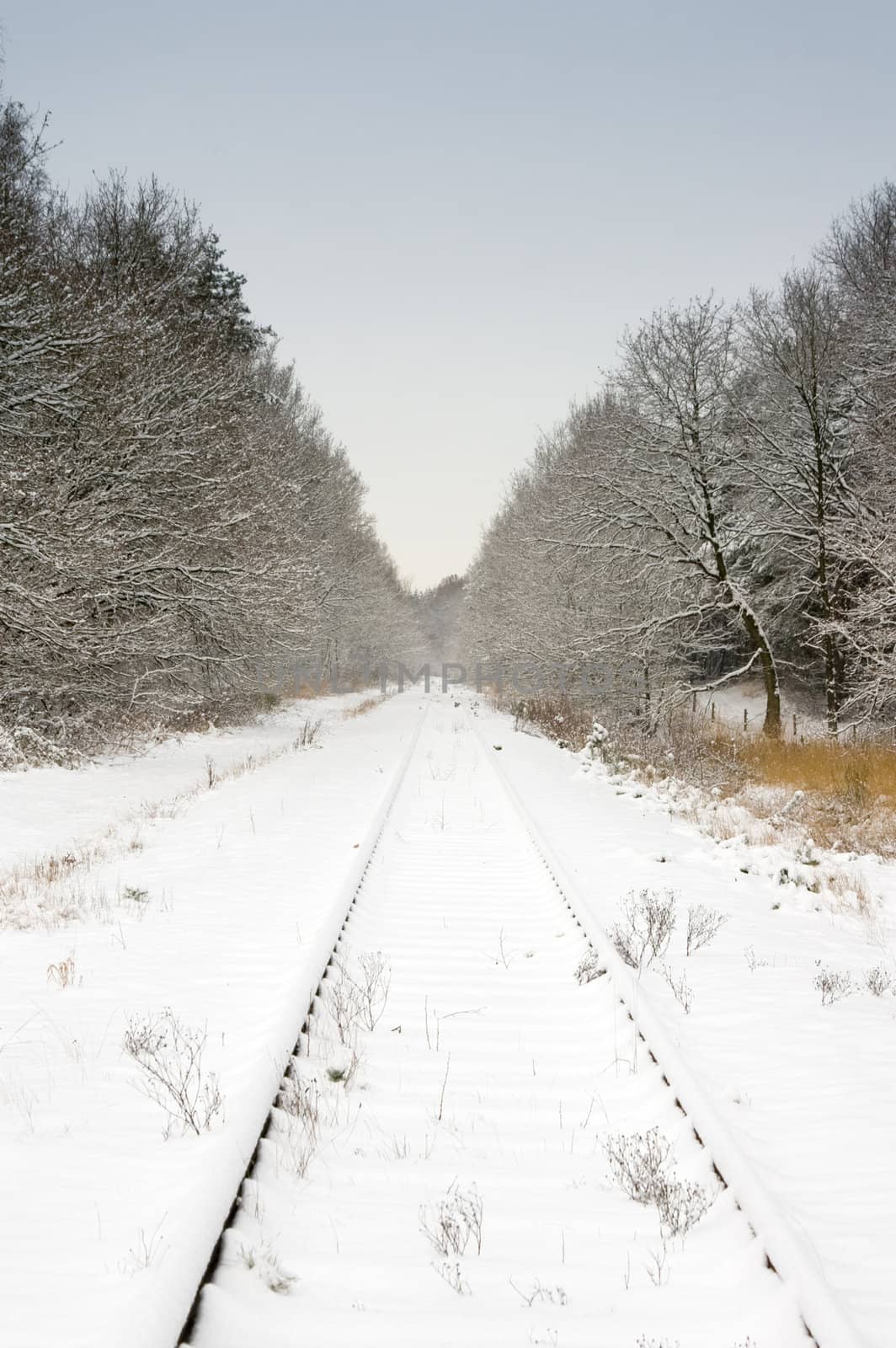 snow and railway with pale blue sky by karinclaus