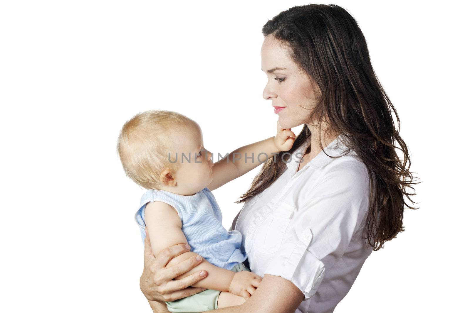 A beautiful image of a young mother and her baby looking at each other. Isolated on white.