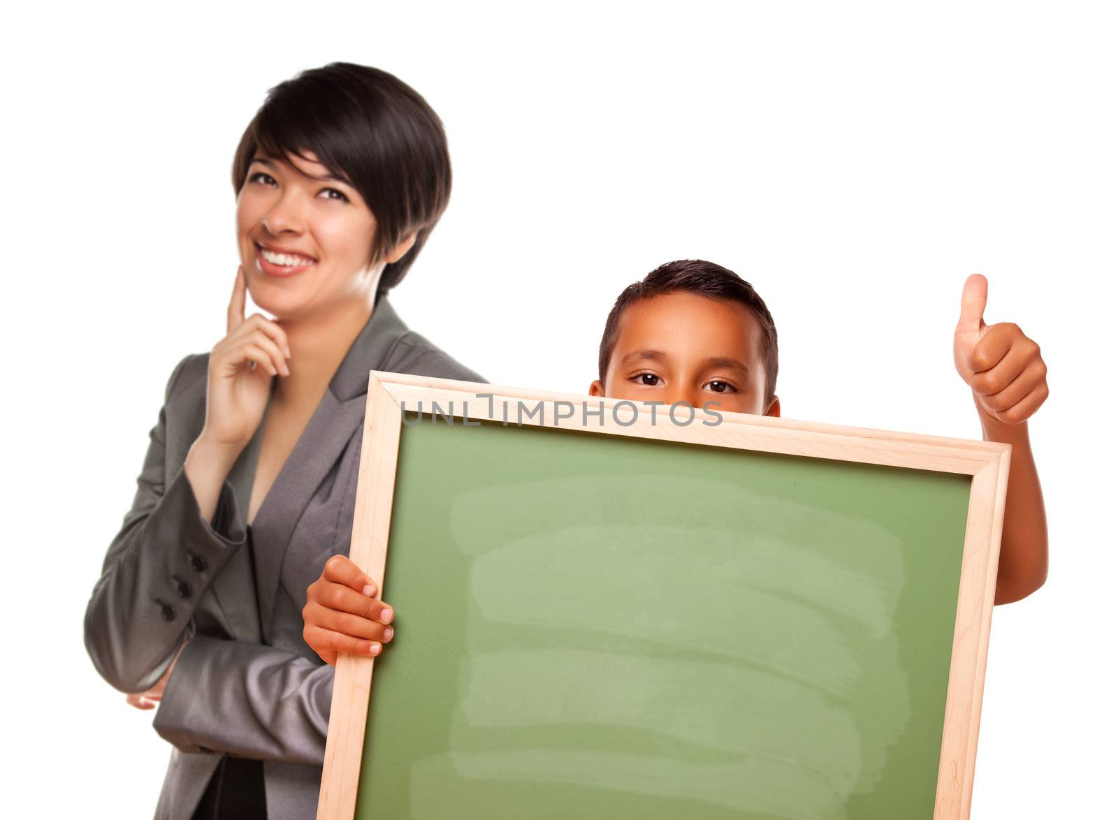 Hispanic Boy Holding Chalk Board with Thumbs Up and Female Teacher Behind Isolated on a White Background.