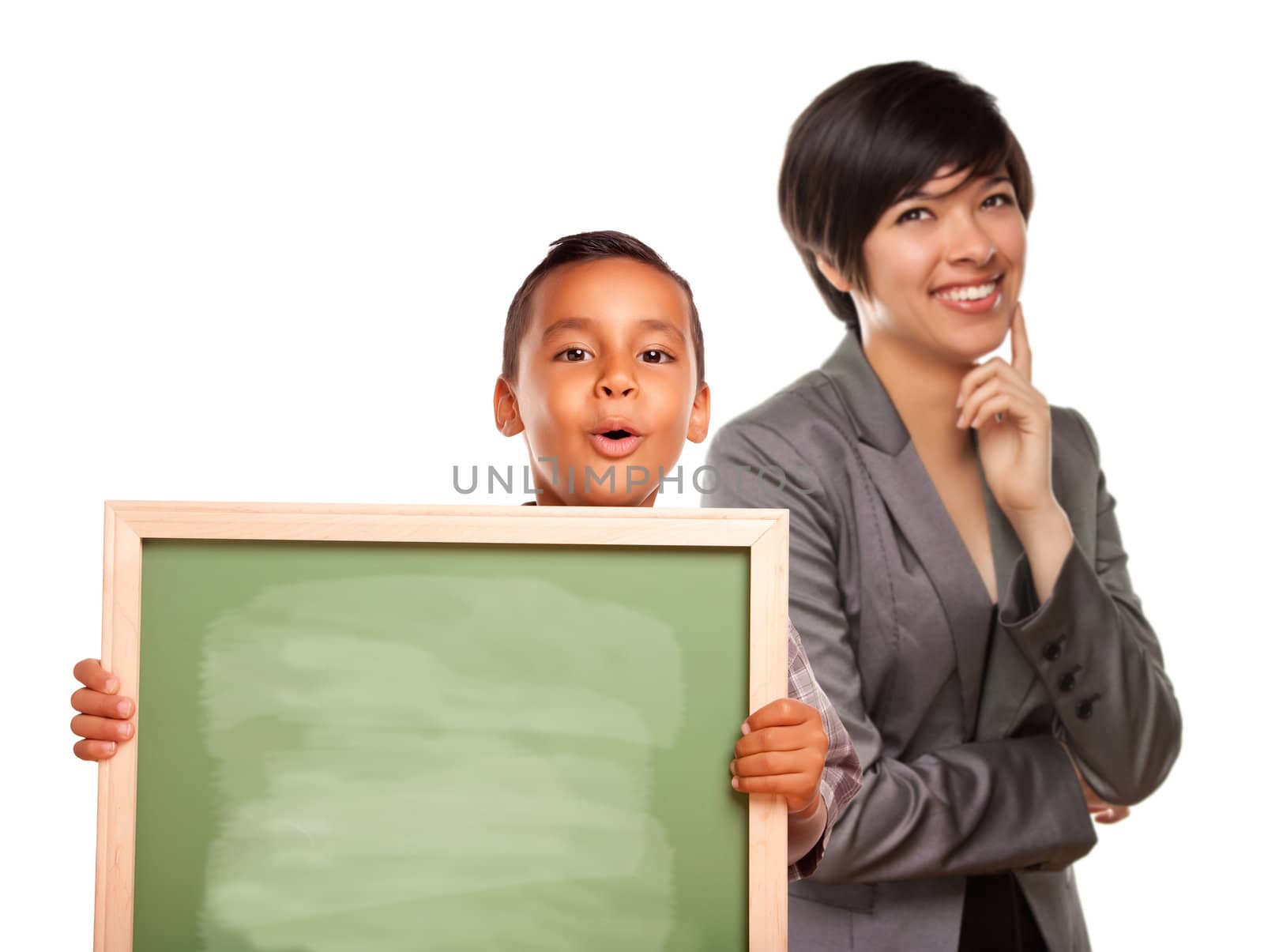 Hispanic Boy Holding Chalk Board and Female Teacher Behind by Feverpitched