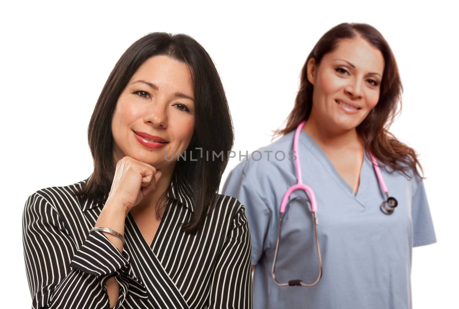 Hispanic Woman with Female Doctor or Nurse Isolated on a White Background.