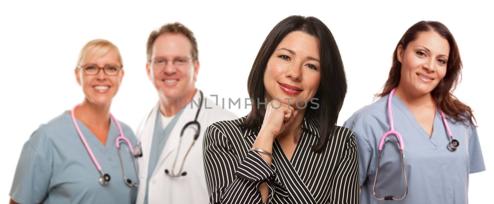 Hispanic Woman with Male and Female Doctor or Nurse Isolated on a White Background.