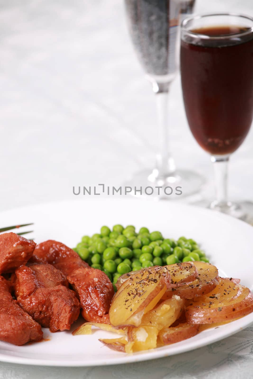 Delicious barbecued pork meal on table setting