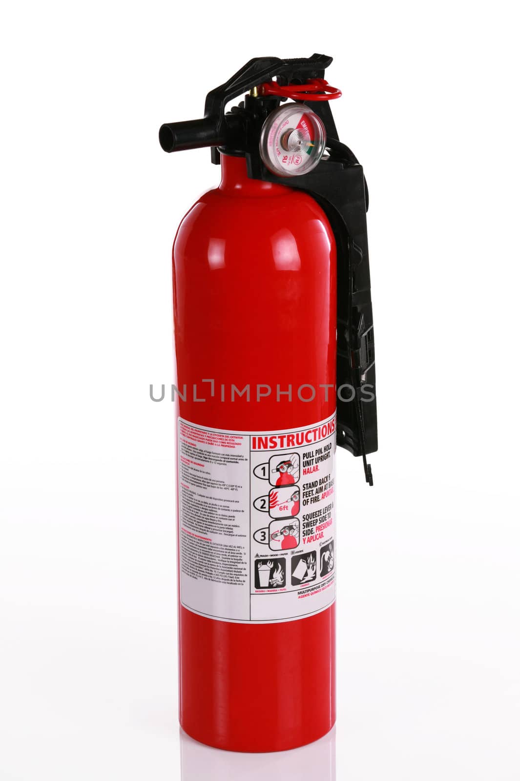 Red fire extinguisher isolated on white