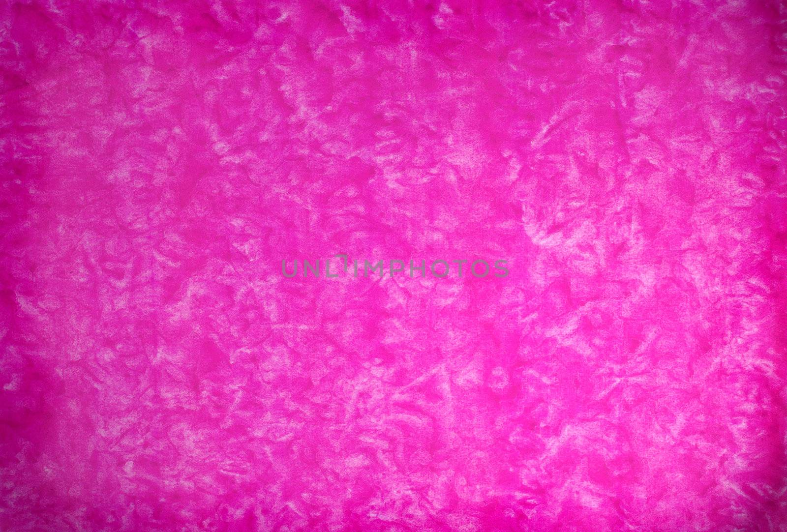 Pink mottled grunge background in variating hues