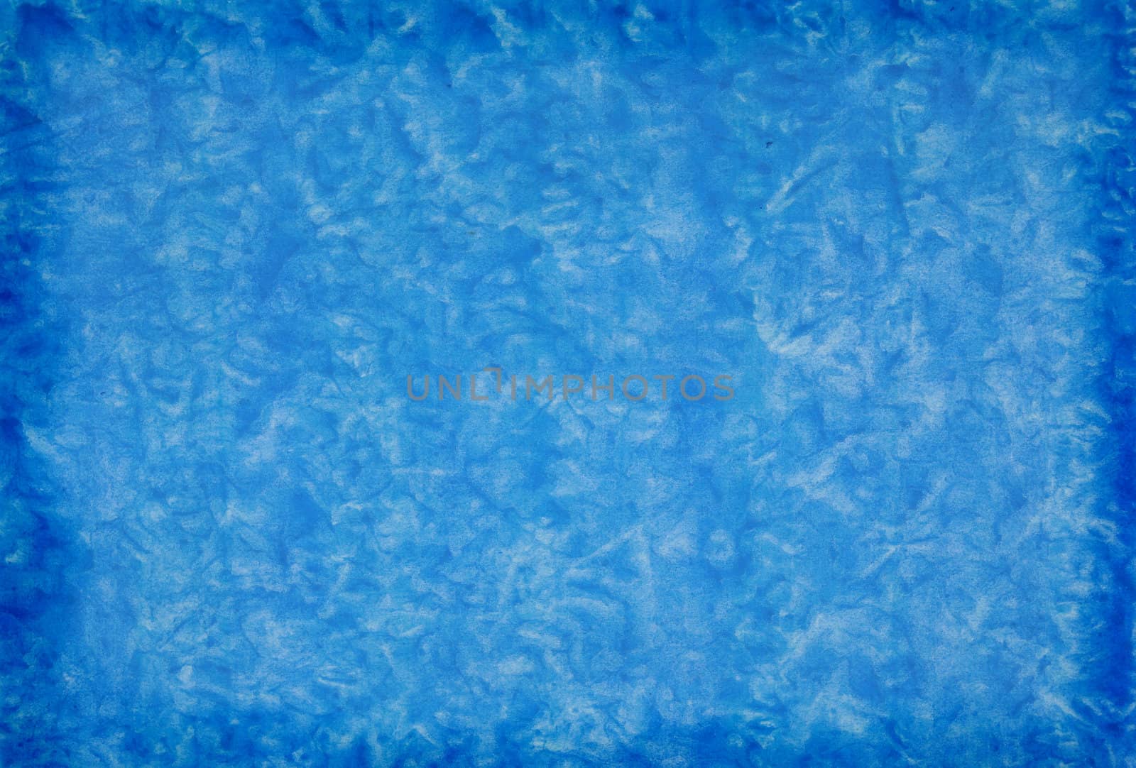 Blue mottled grunge background in variating hues