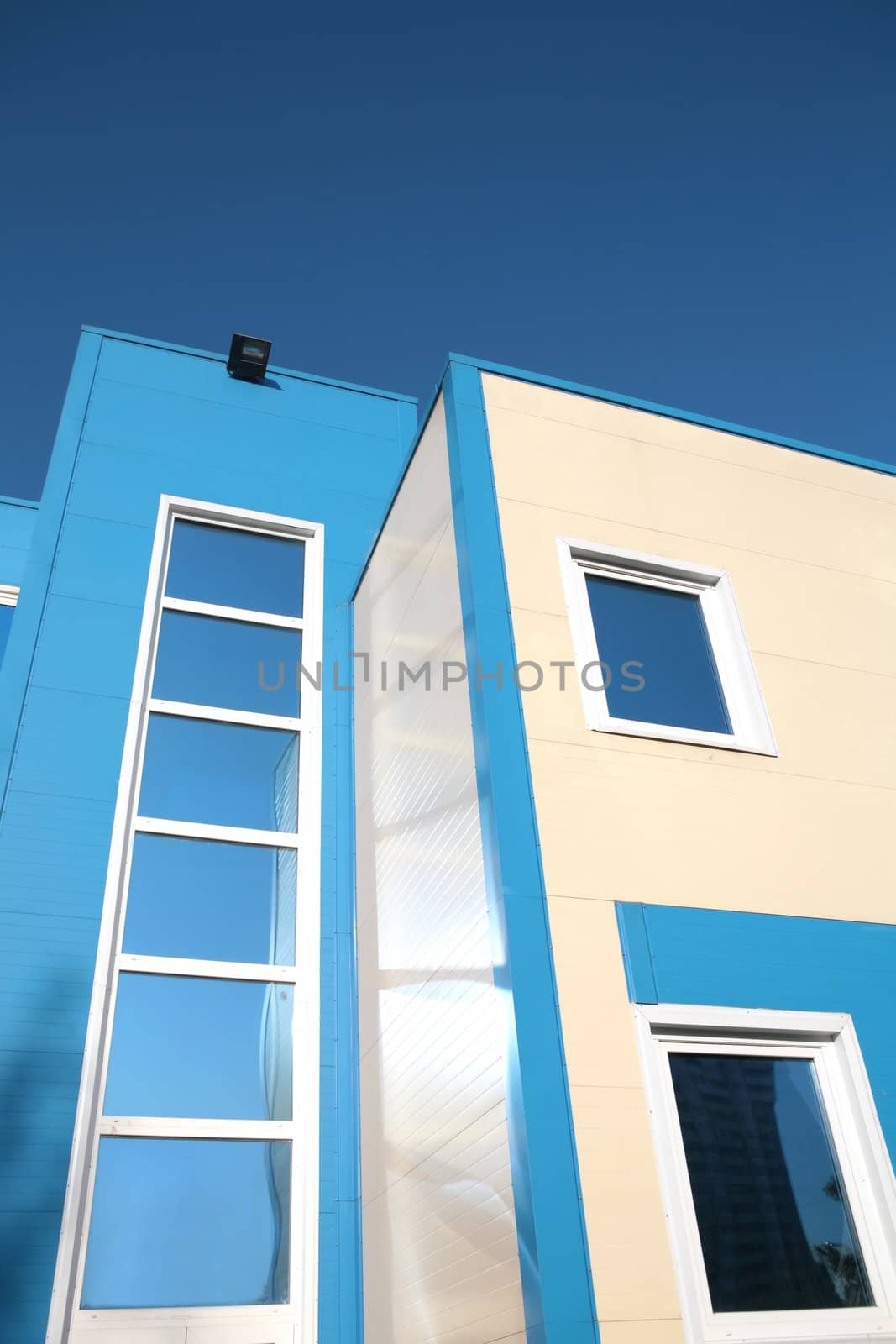 fragment of the new building on background blue sky