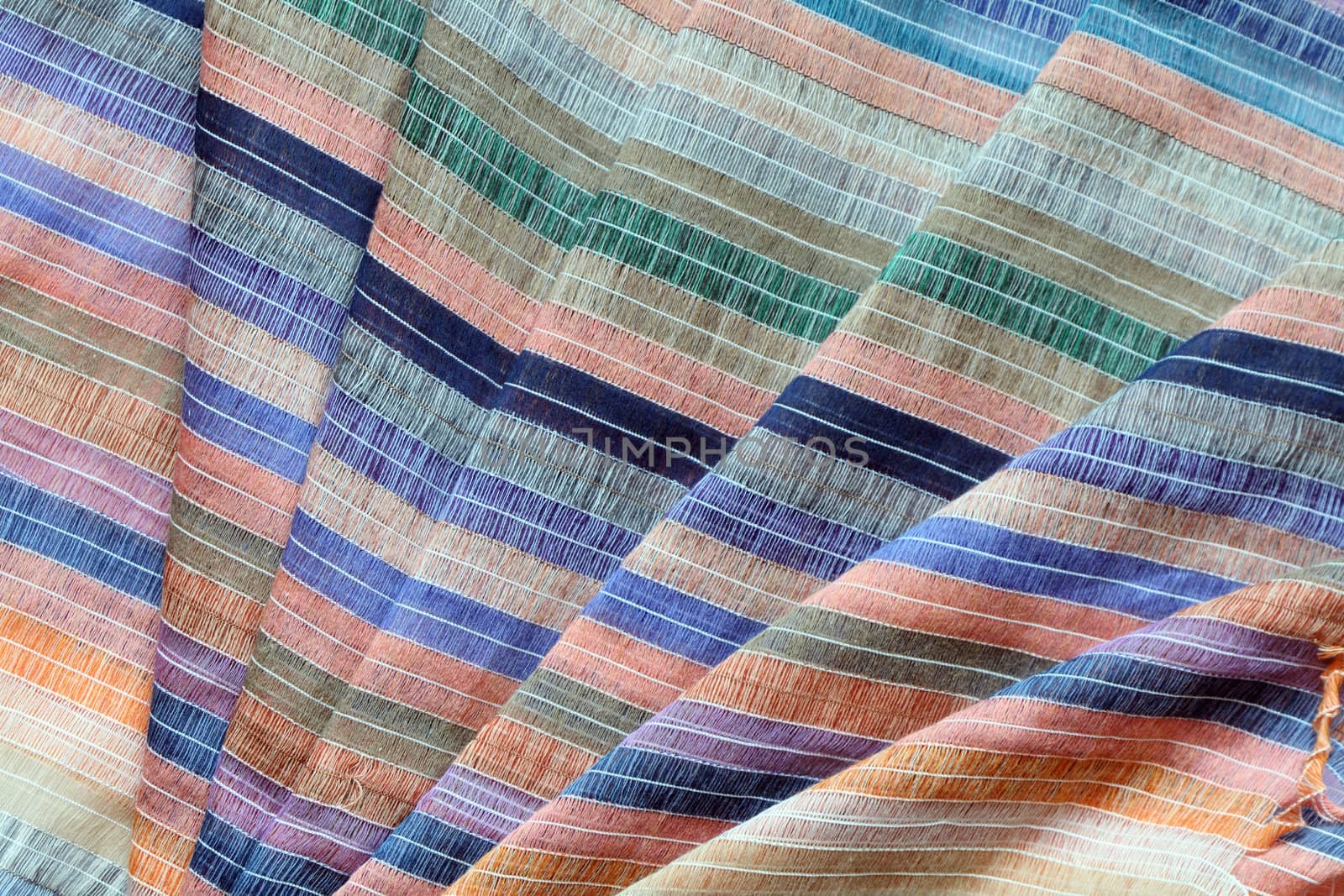 Background made from nice striped multi colored cotton fabric