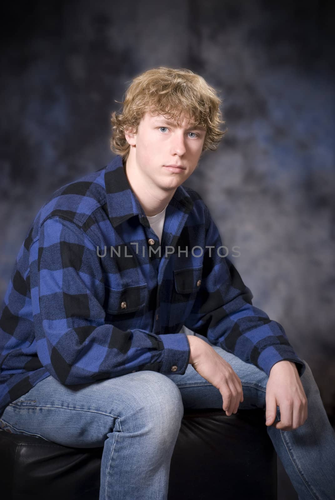 Handsome young man with a pleasant look, engaging the viewer.