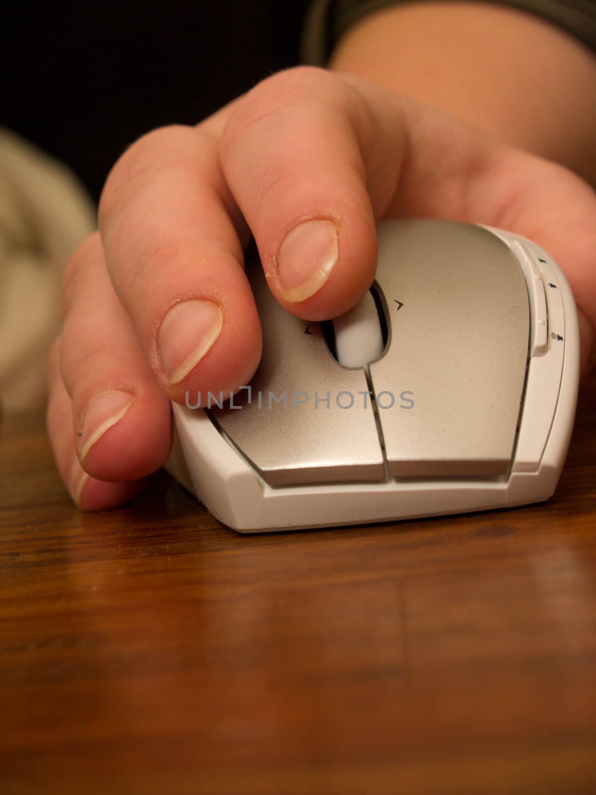 Human hand using silver computer   mouse