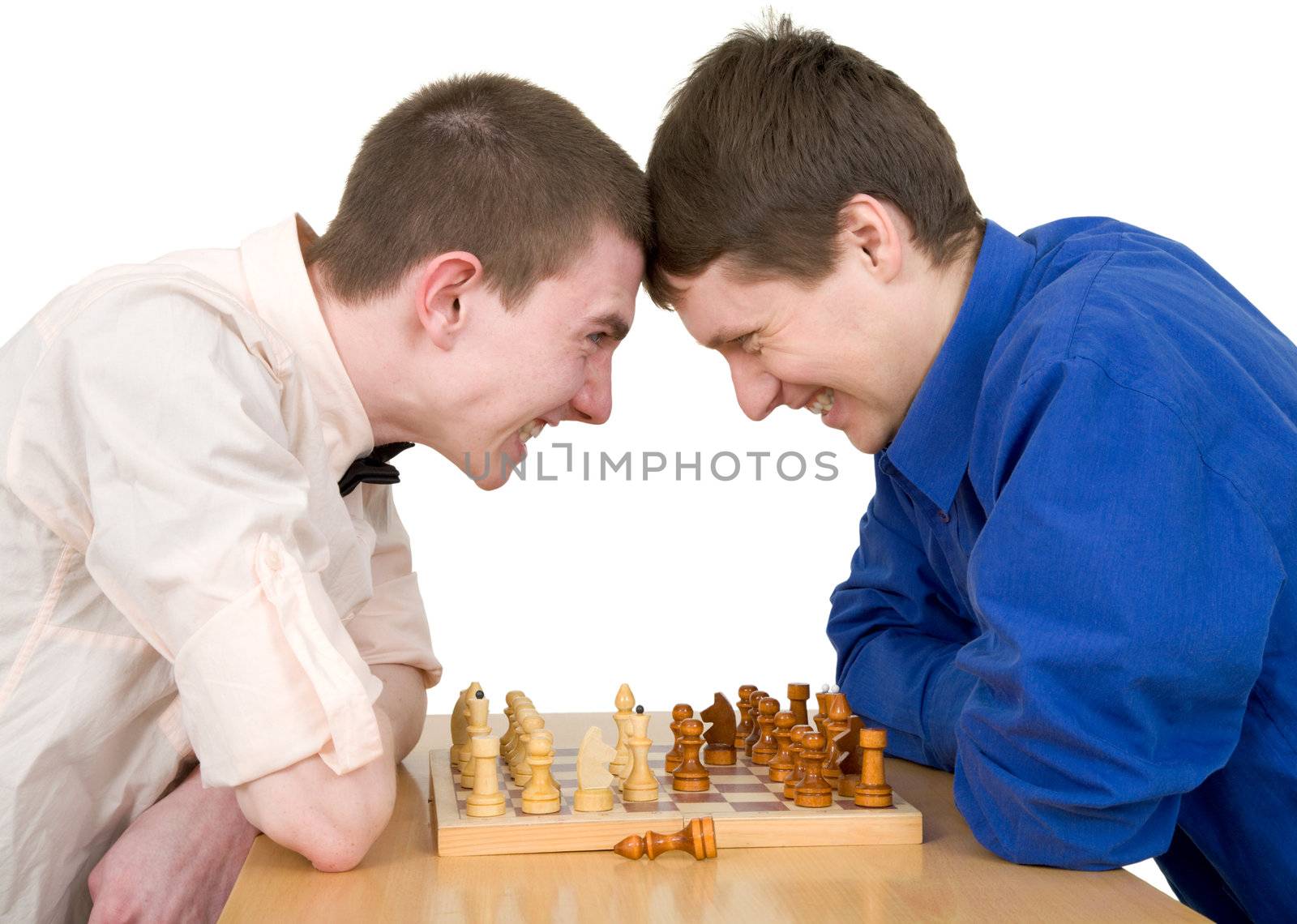 Boys play chess on a white background