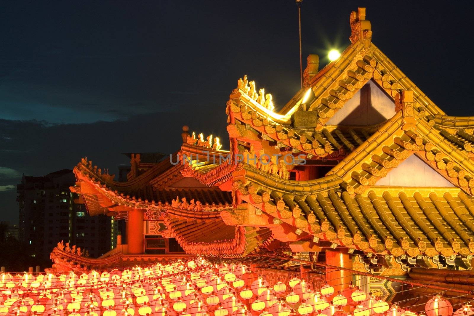Image of a Chinese temple with lanterns in Malaysia at dusk.