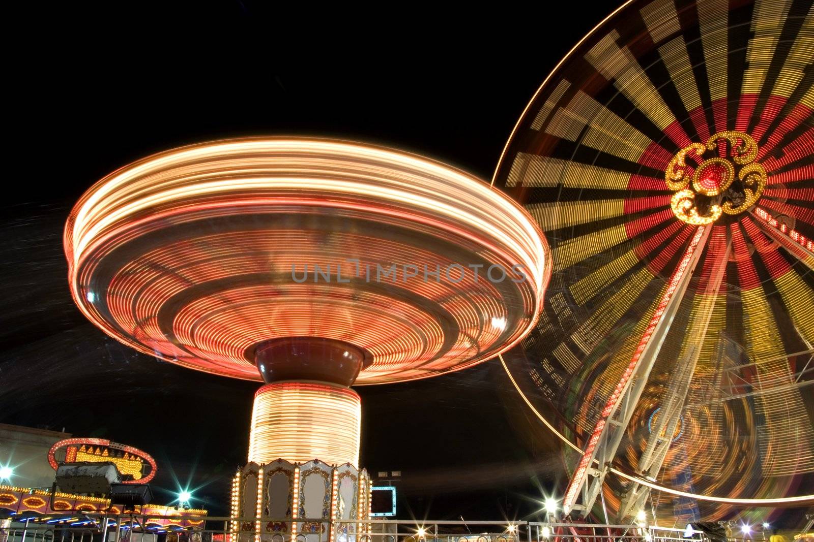 Funfair at Night with Motion Blur by shariffc