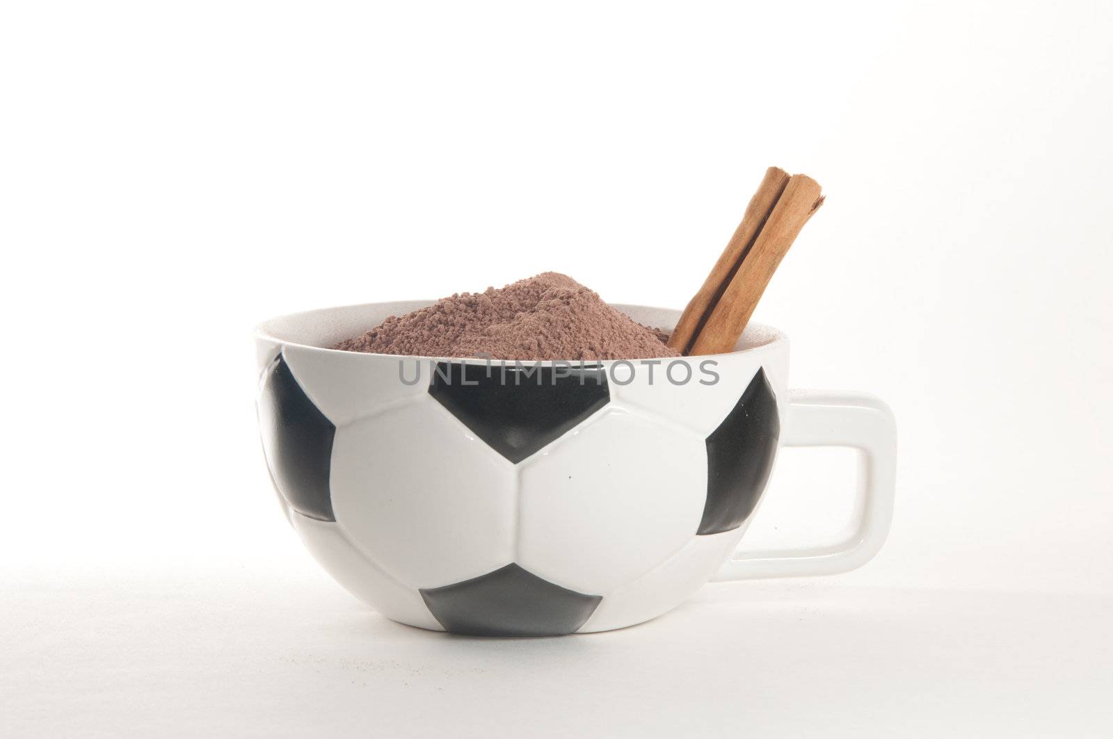 Football(soccer) themed cappucino cup over white background