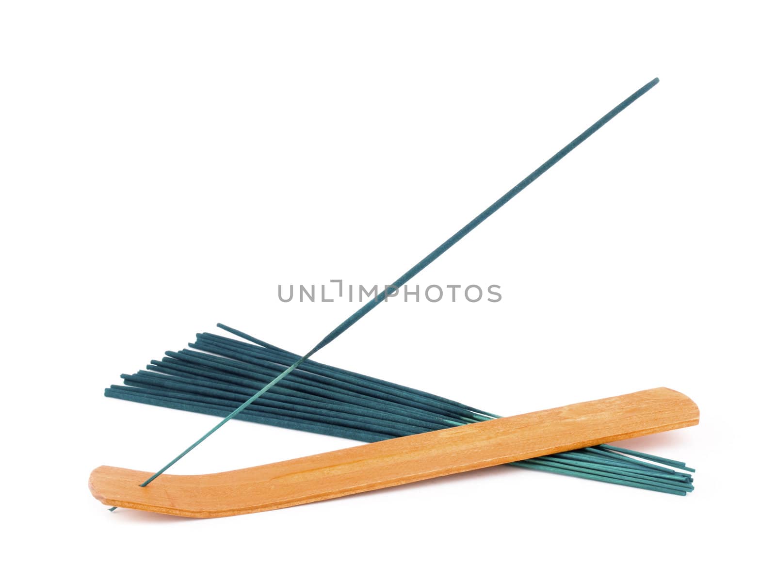 Green incense in wooden holder on white background