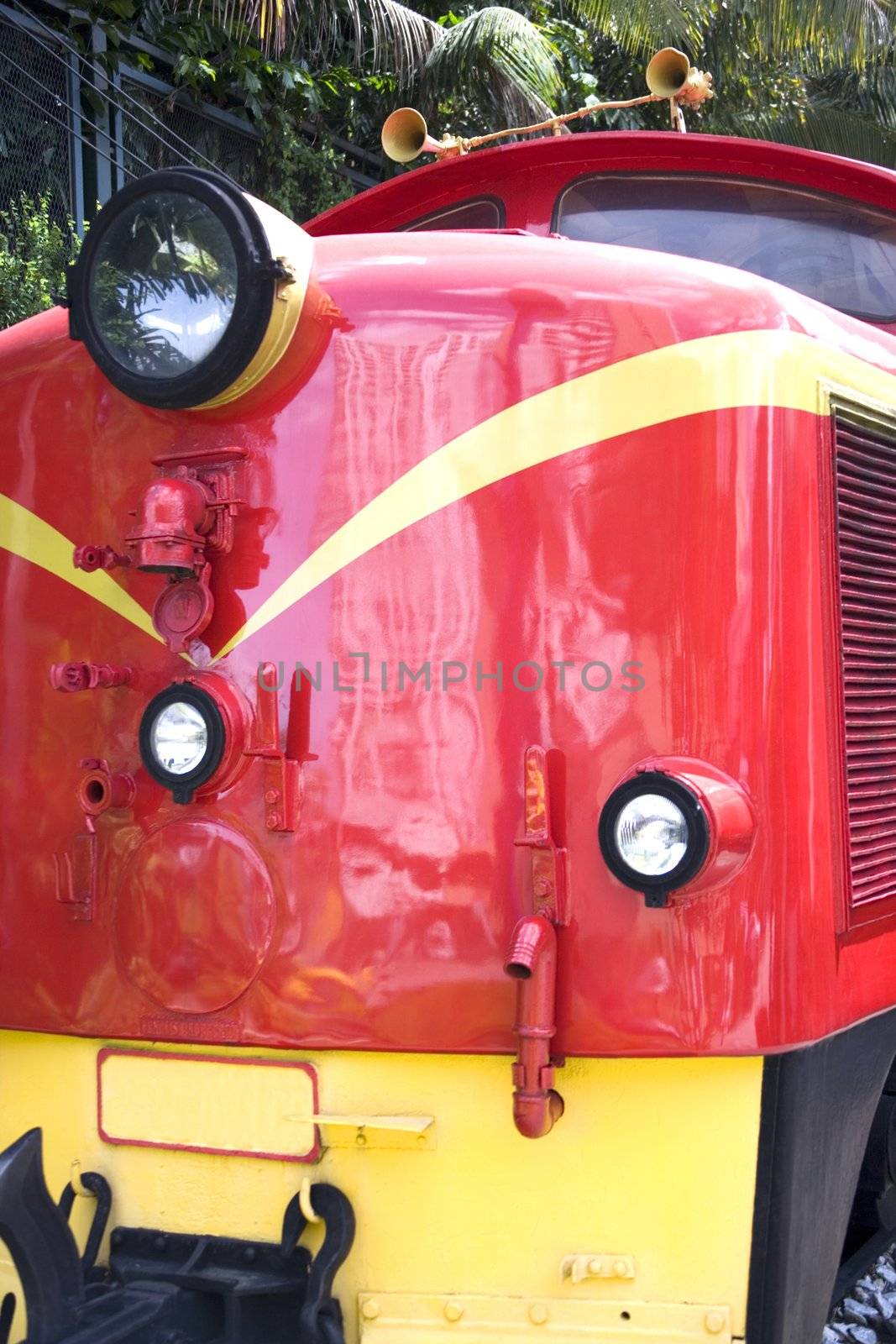 Image of a bright red vintage diesel train.