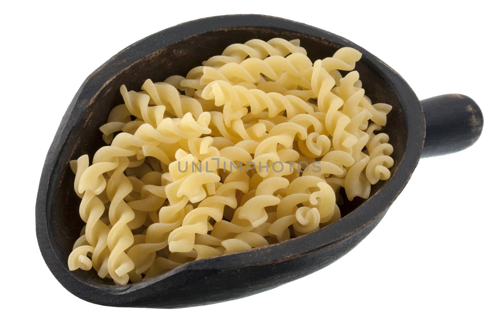 fusilli, corkscrew shaped, Italian pasta on a rustic, wooden scoop, isolated on white