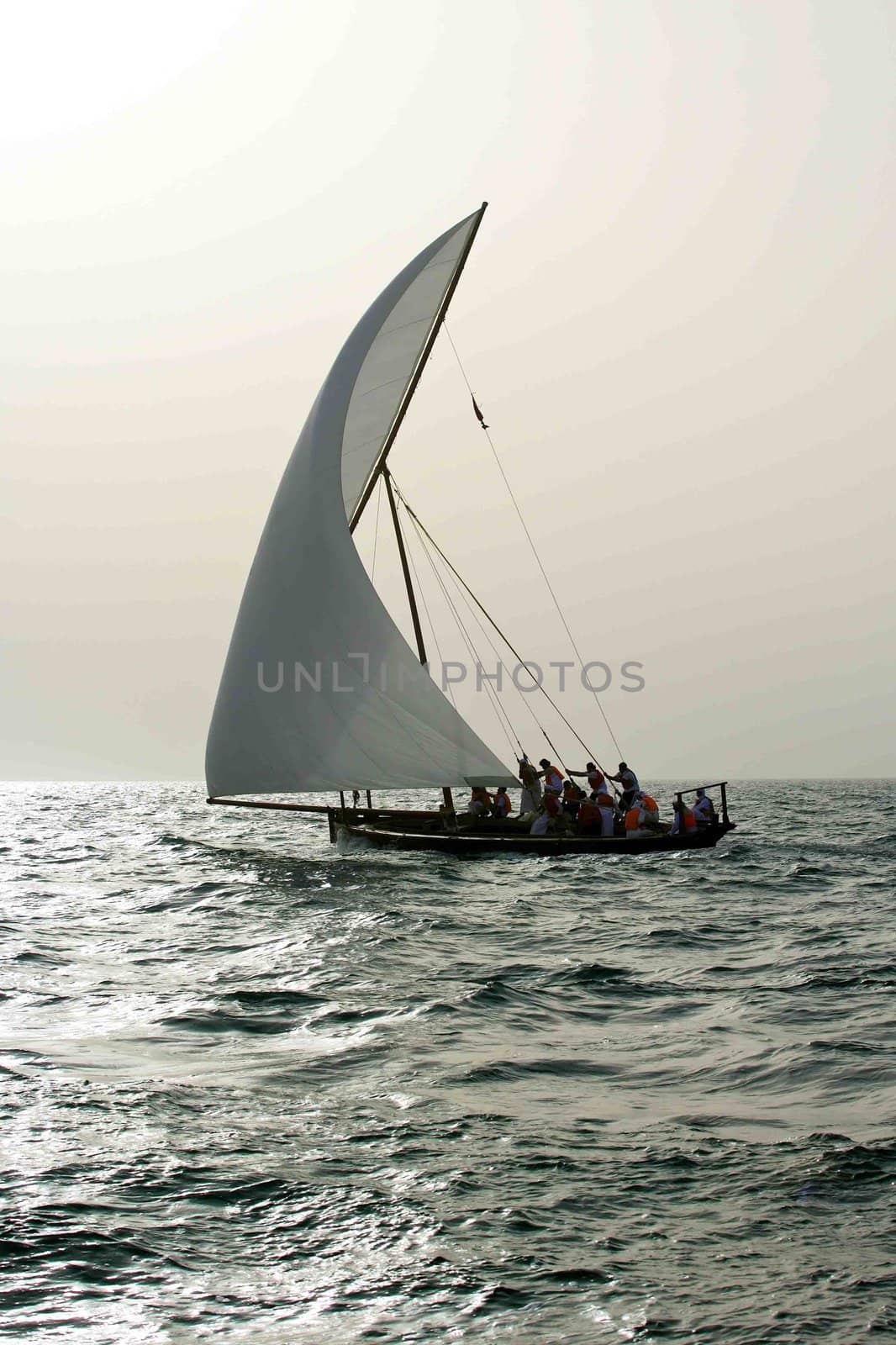 A traditional dhow sailing in the Arabian Gulf near Dubai.