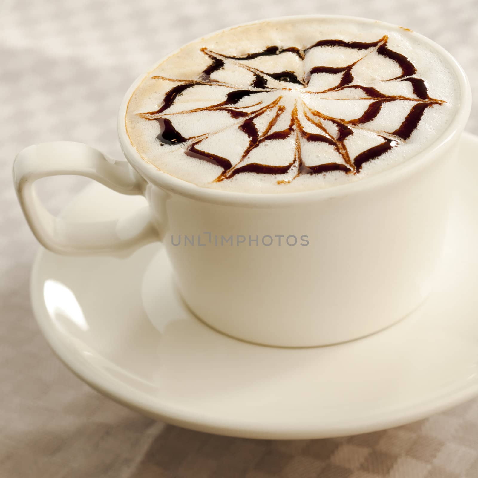 Coffee cup with chocolate web on top