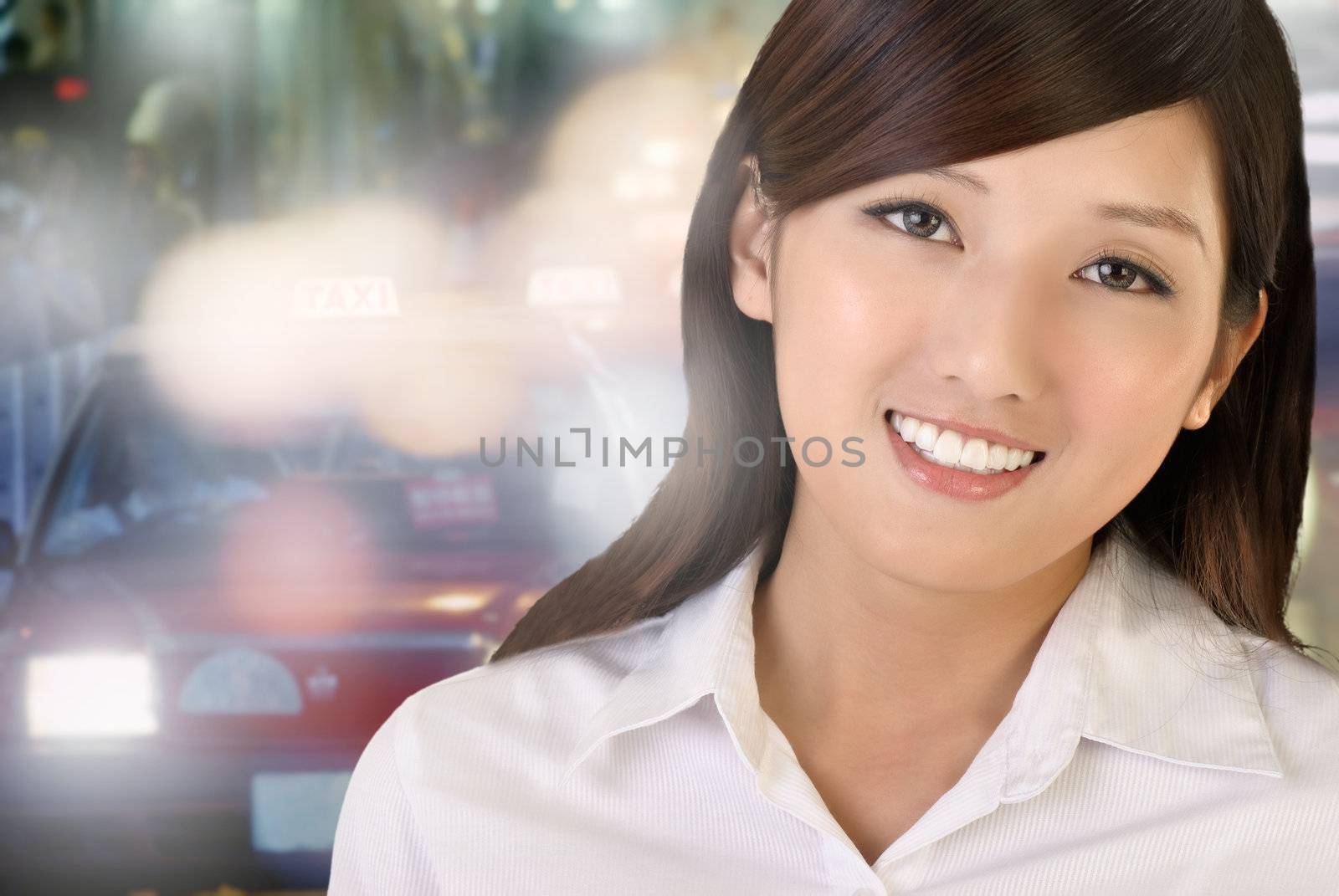 Smiling business woman on street in night, closeup portrait of oriental office lady.