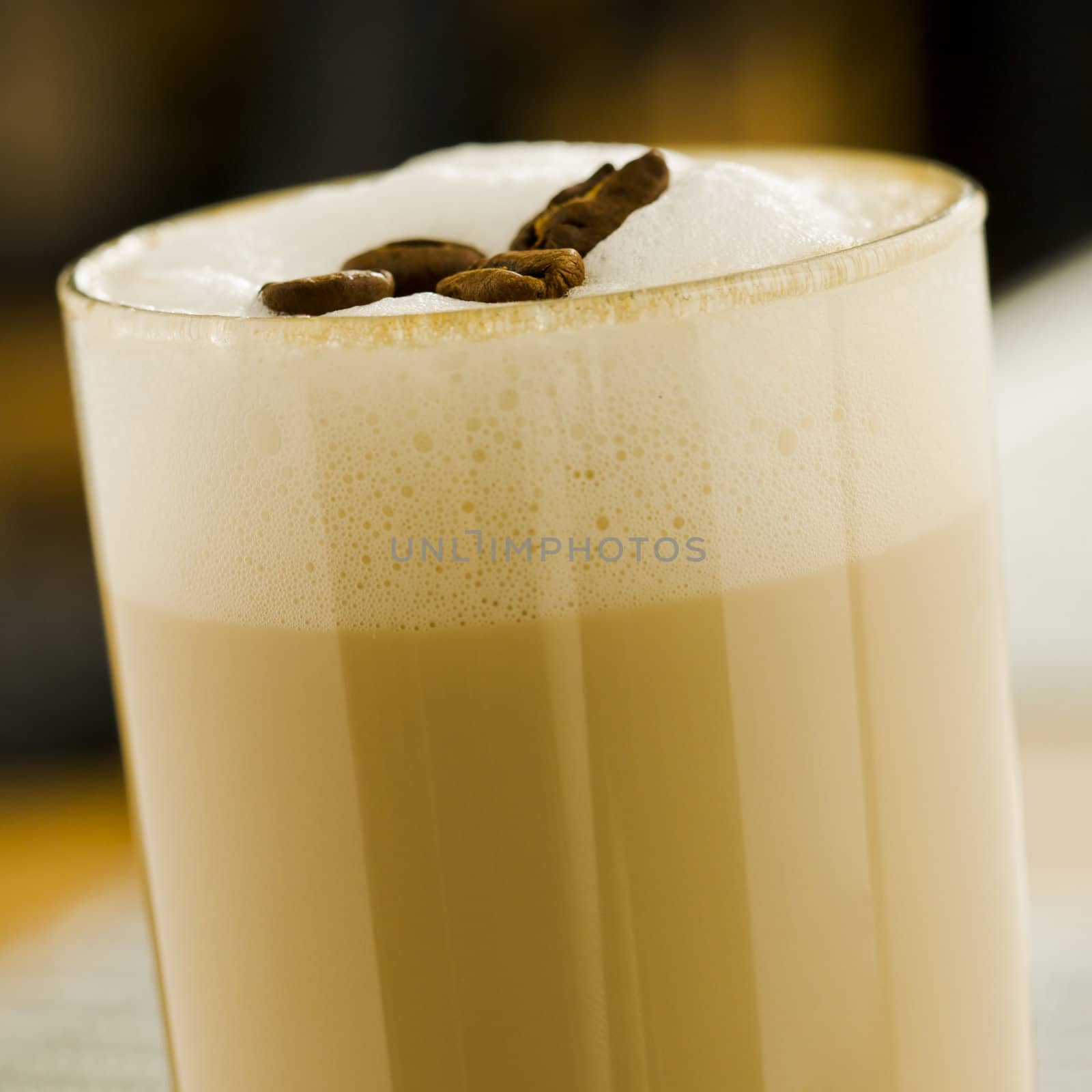 Coffee with foam and beans on the top