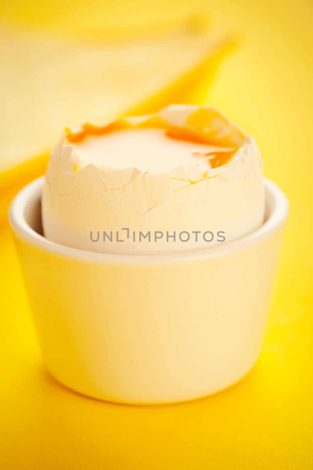 Boiled 3 minutes egg on the yellow table