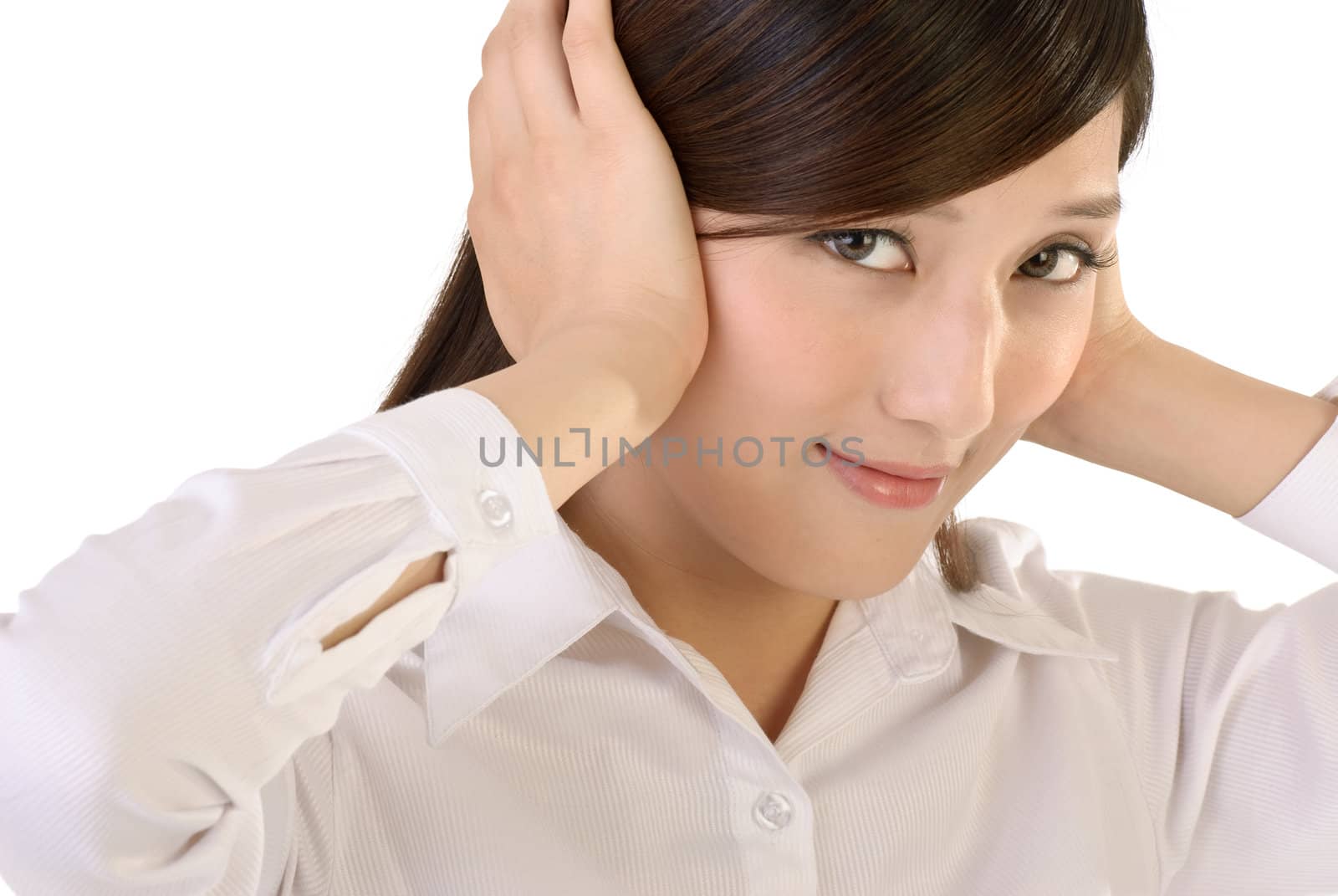 Beautiful businesswoman put hands on ears, closeup portrait of oriental office lady on white background.