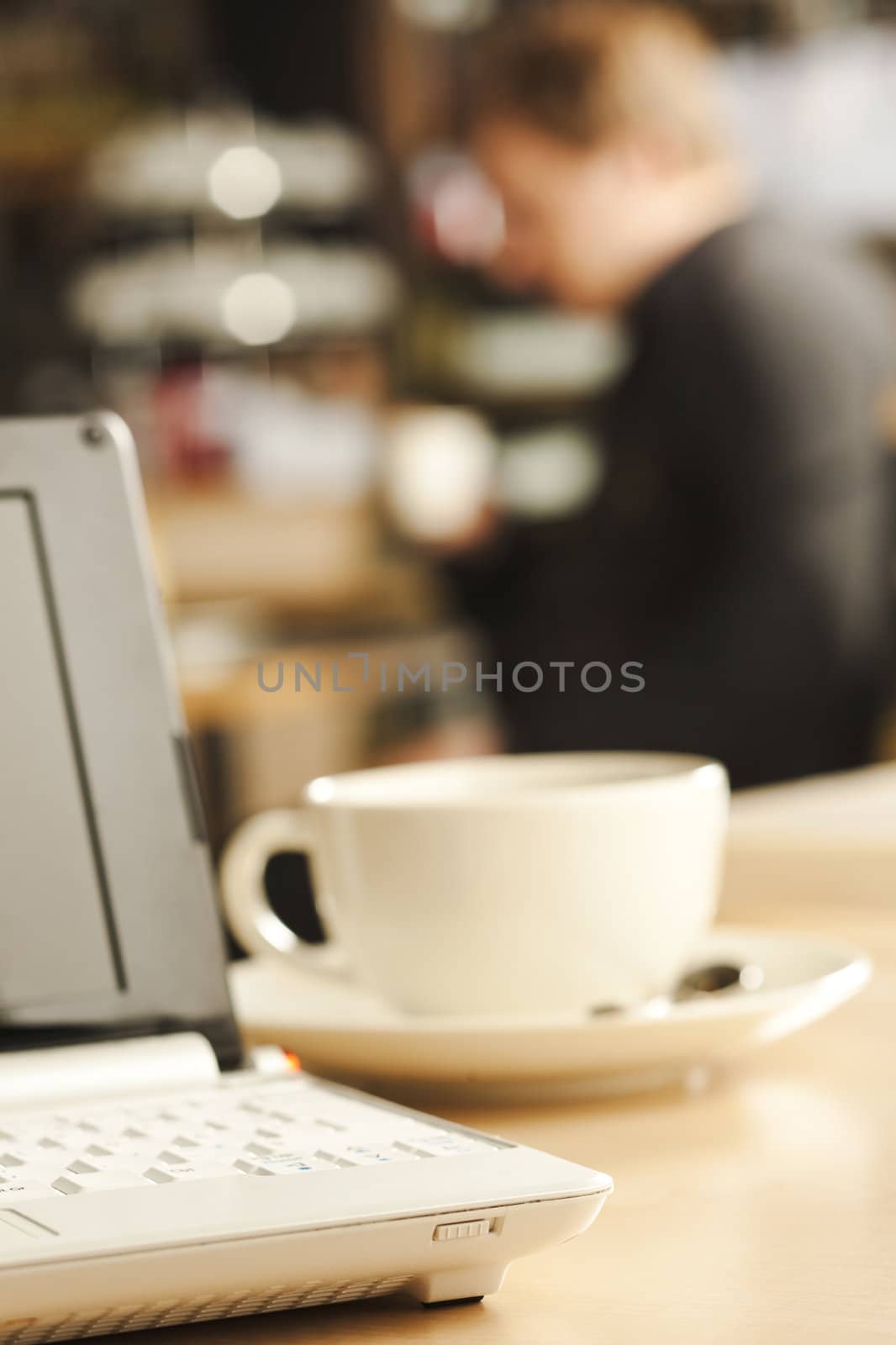 Small laptop on the coffee shop table