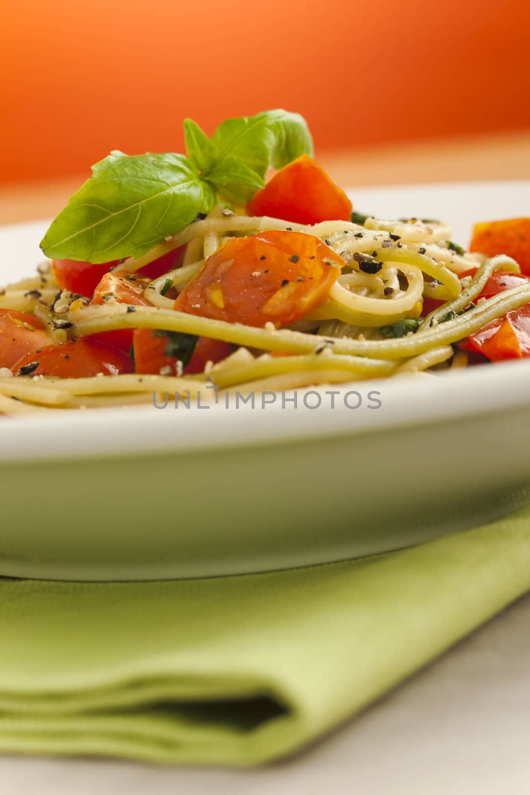 Spaghetti with cherry tomatoes on the table