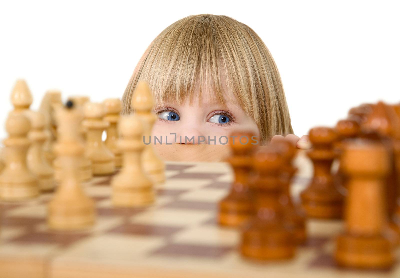 Child and chess on a white background
