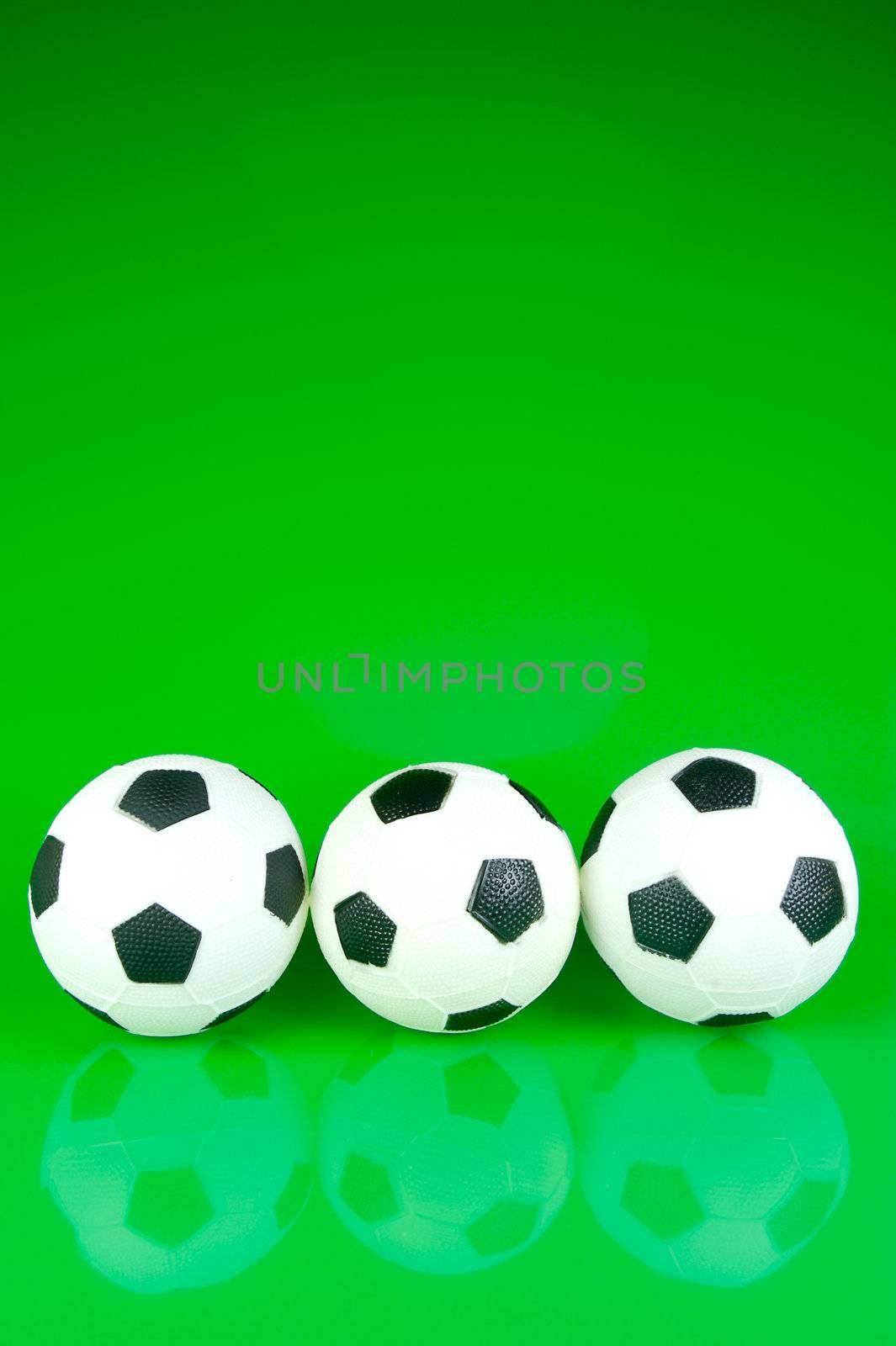 A soccor ball isolated against a green background