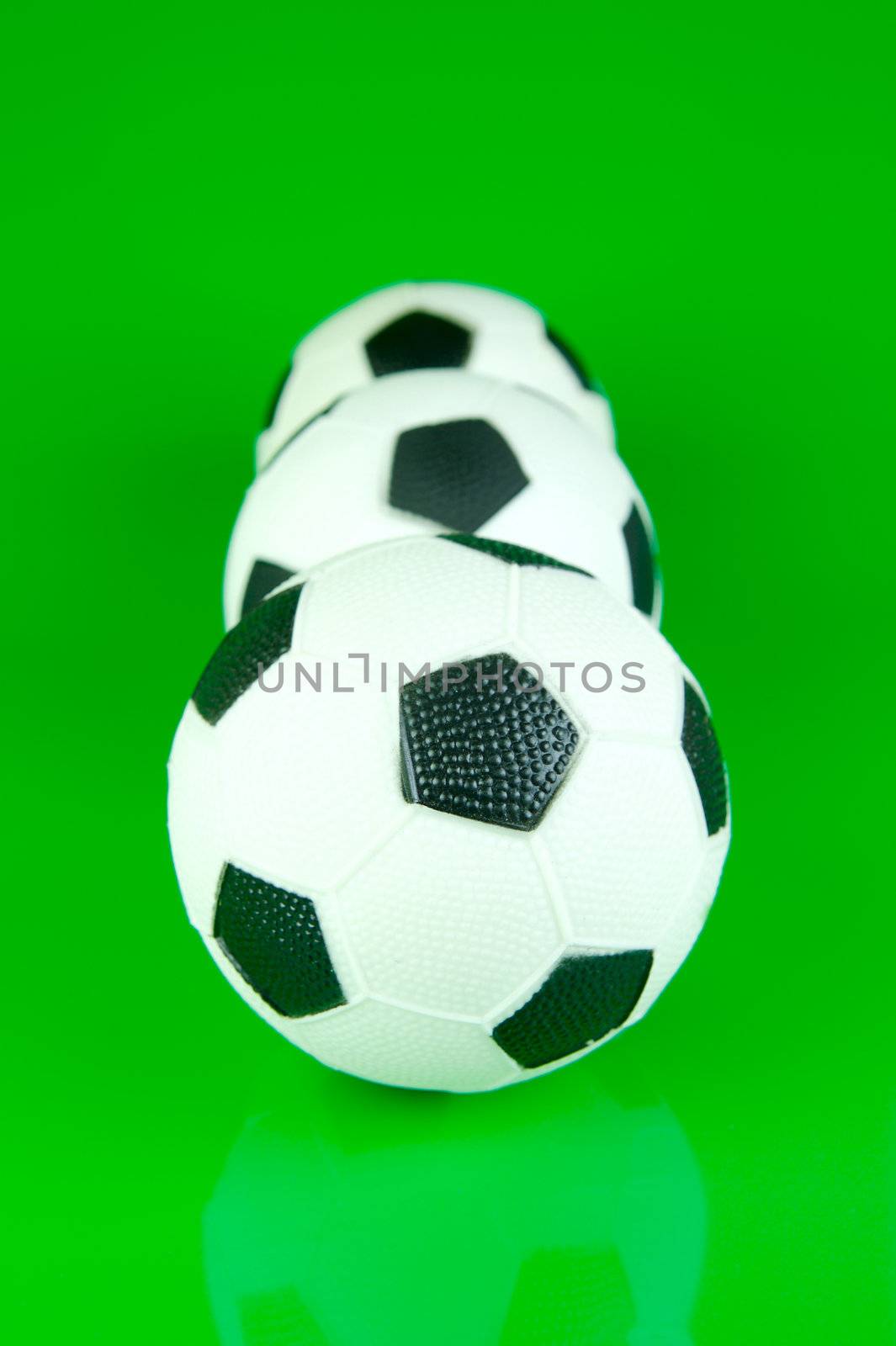 A soccor ball isolated against a green background