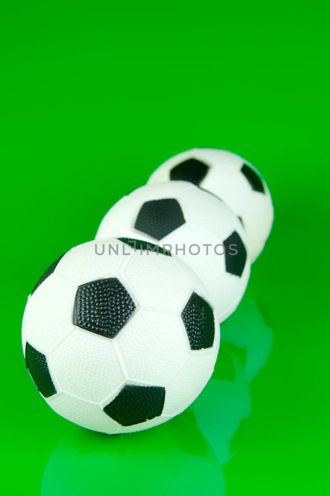 A soccor ball isolated against a green background