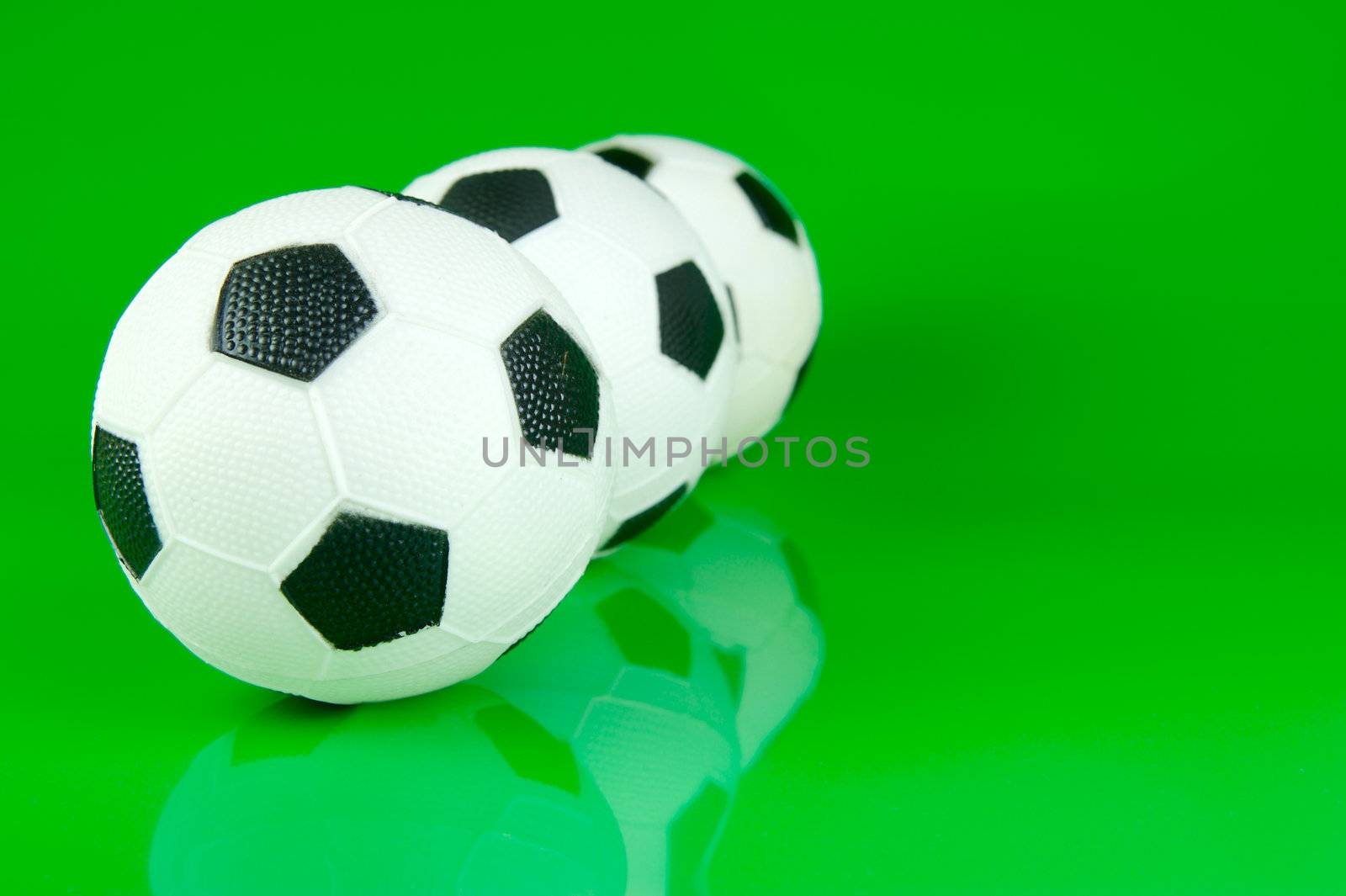 A soccor ball isolated against a green background