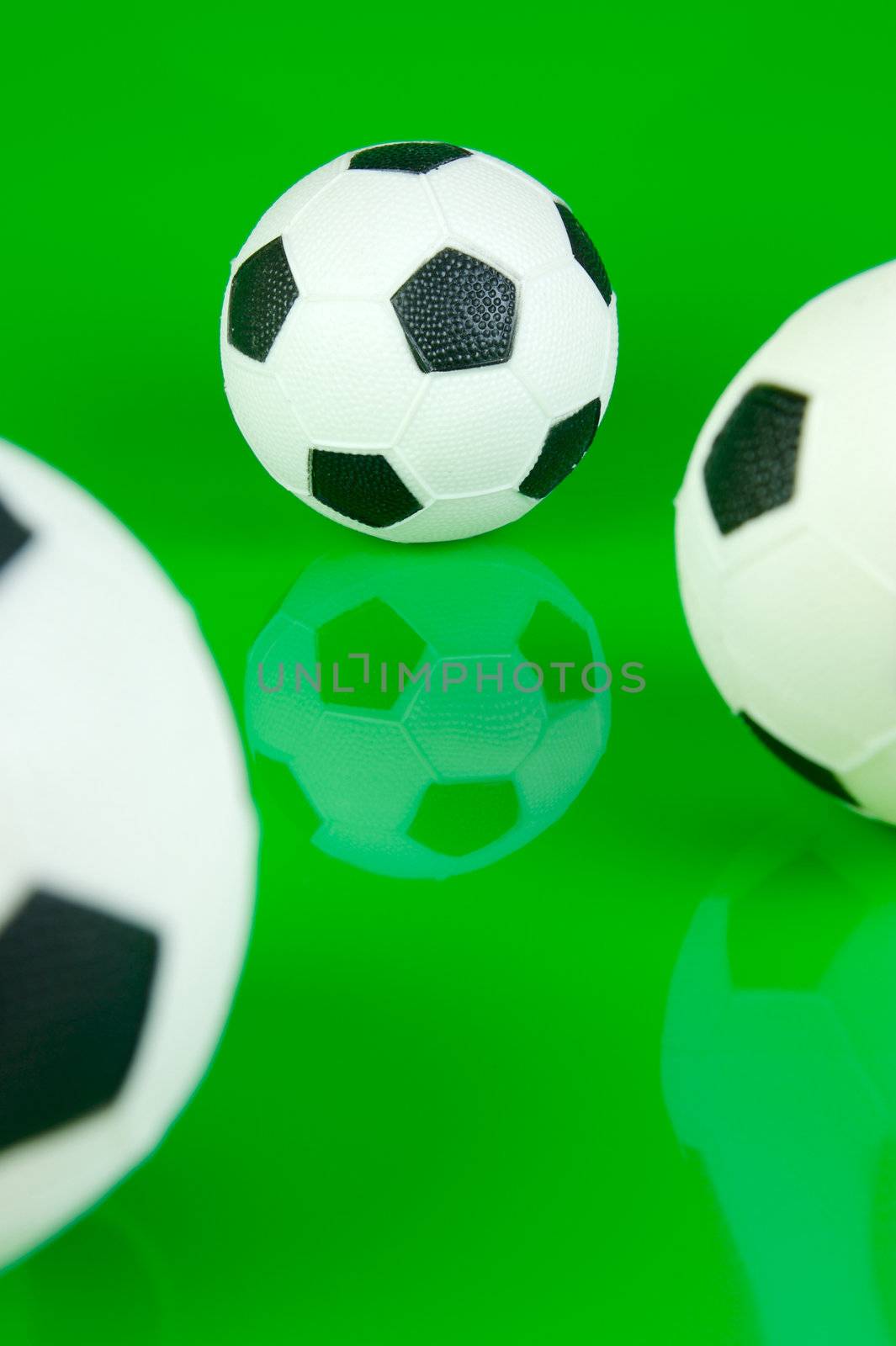 A soccor ball isolated against a green background