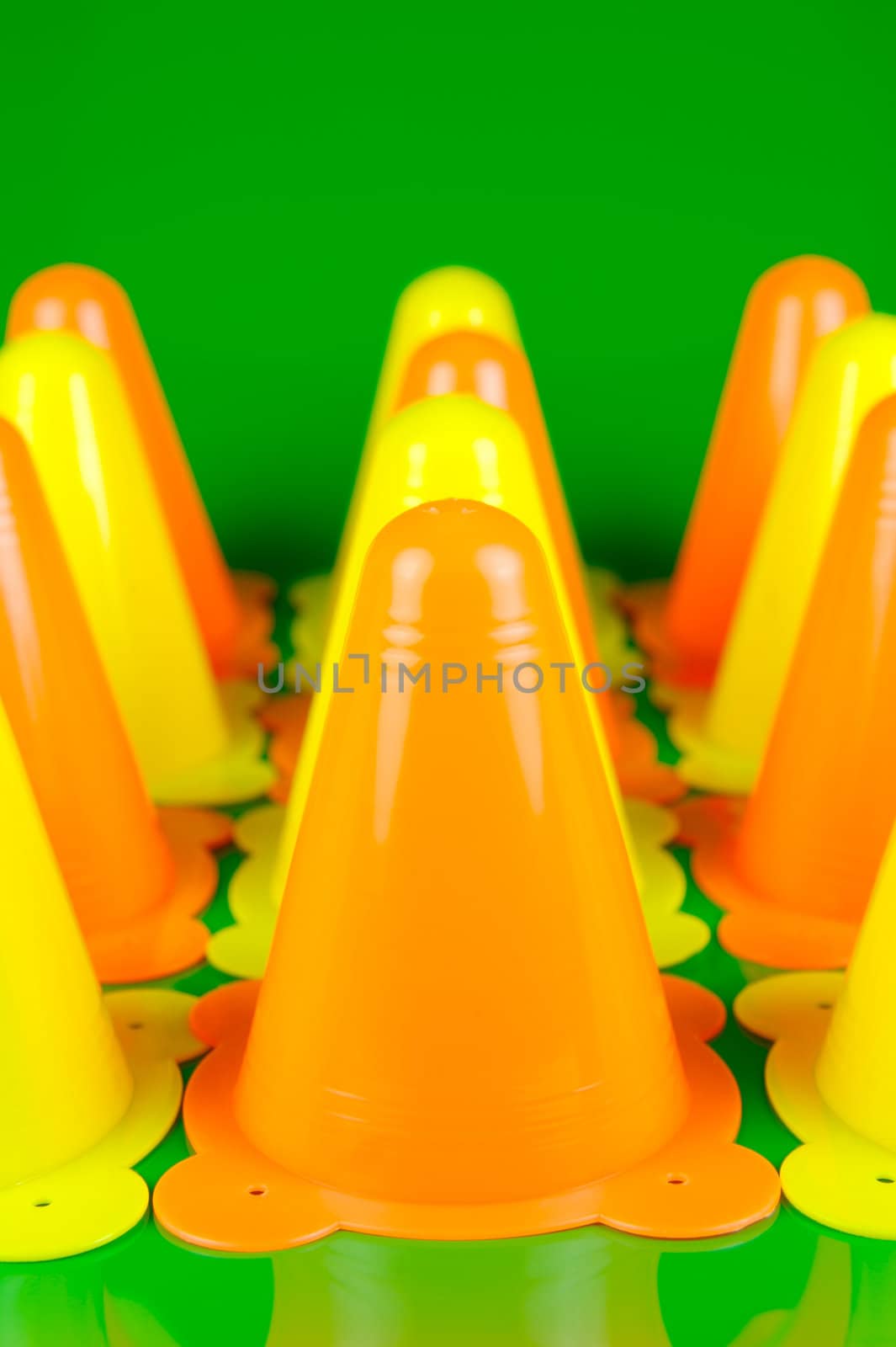 Witches hats isolated against a green background