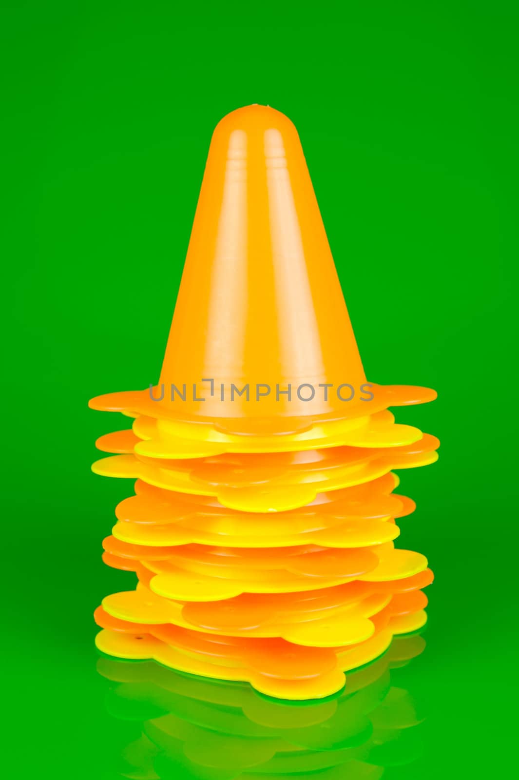 Witches hats isolated against a green background