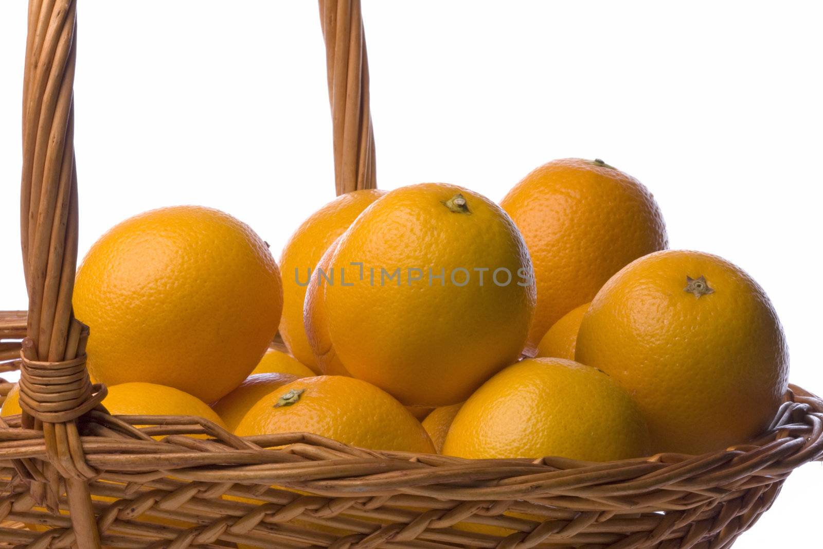 Isolated image of oranges in a basket against a completely white background.