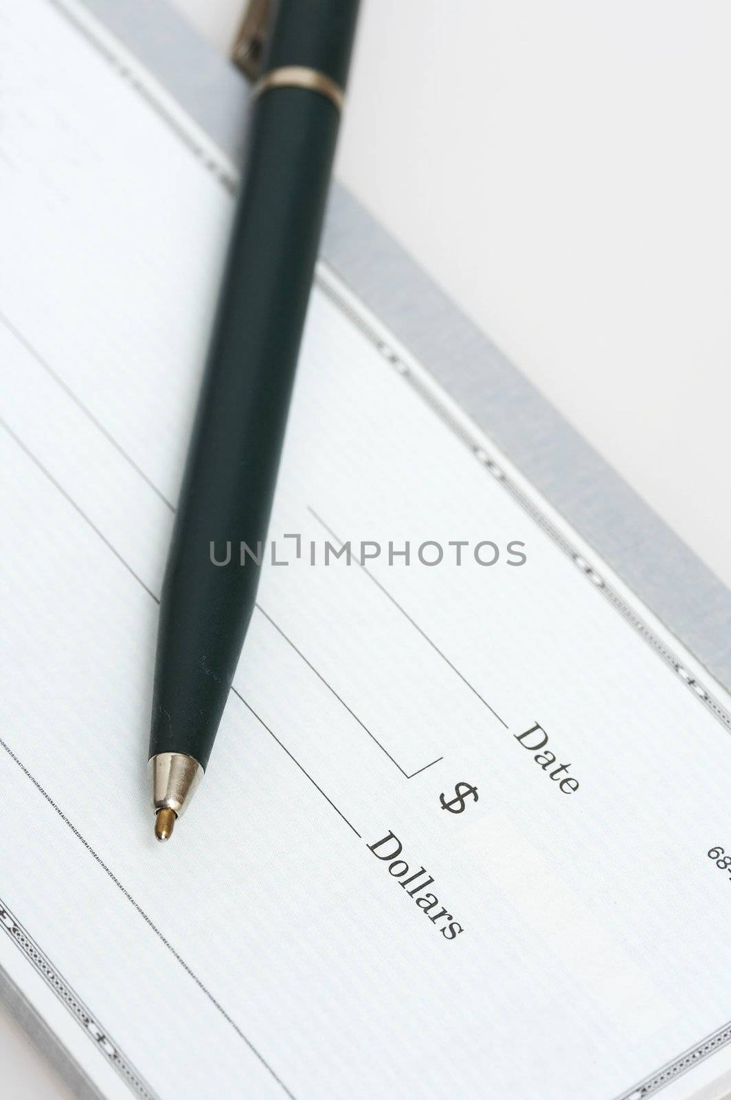a close up picture of a pen and check
