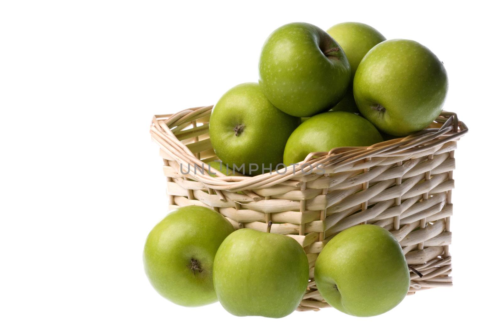 Isolated image of green apples in a basket.