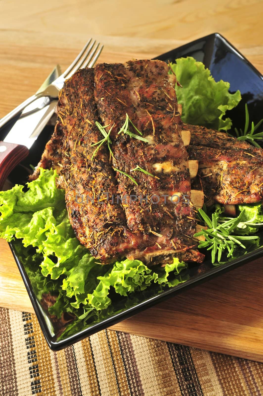 Plate of spare ribs and greens for dinner