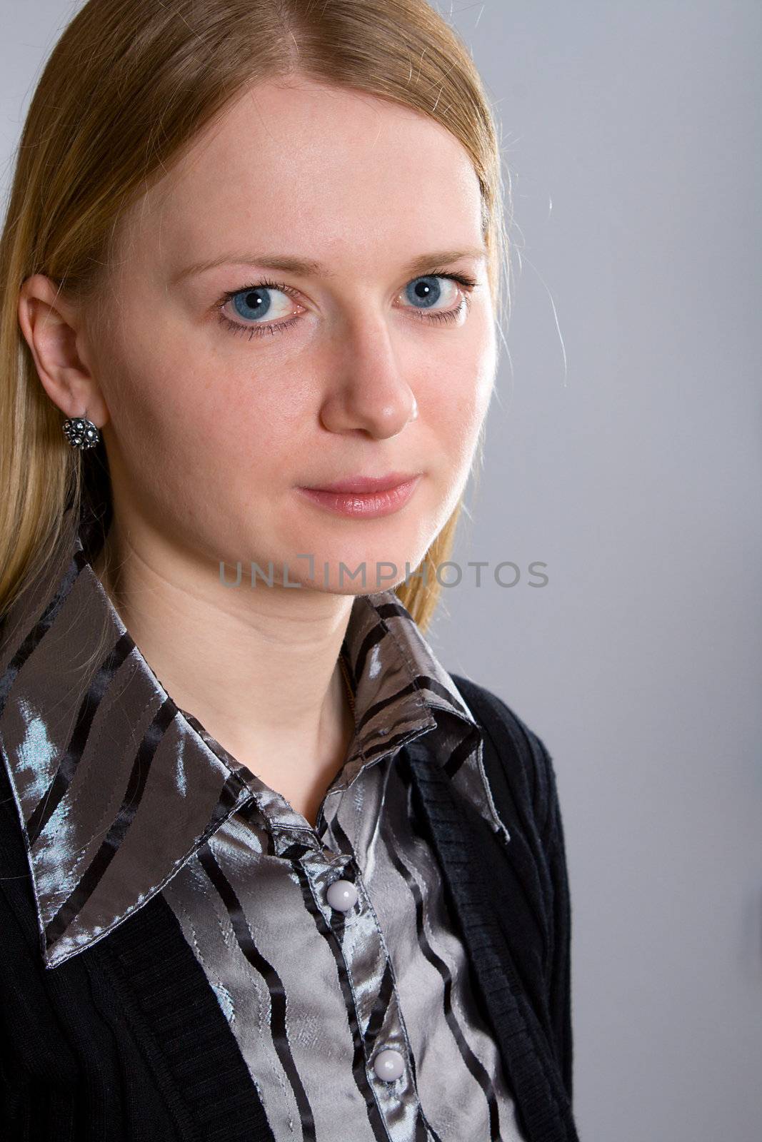 portrait of young woman on gray background