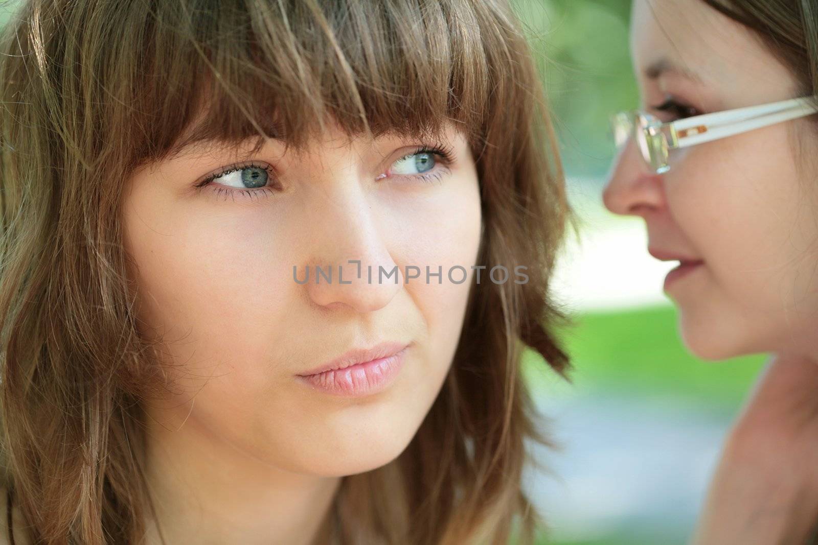 close-up portrait of the two young and beautiful girls