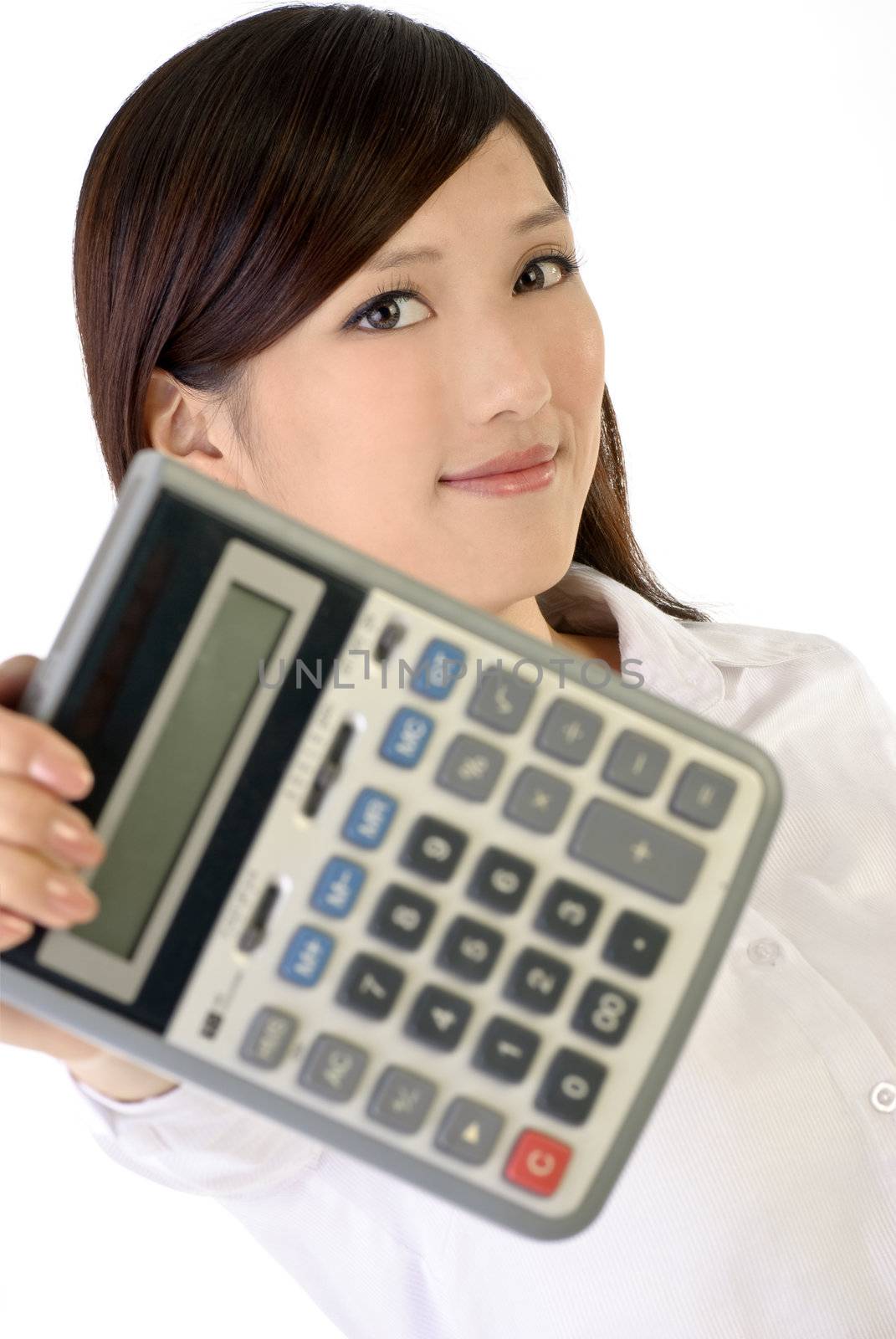 Business woman holding calculator, closeup portrait of oriental office lady on white background, focus on face.