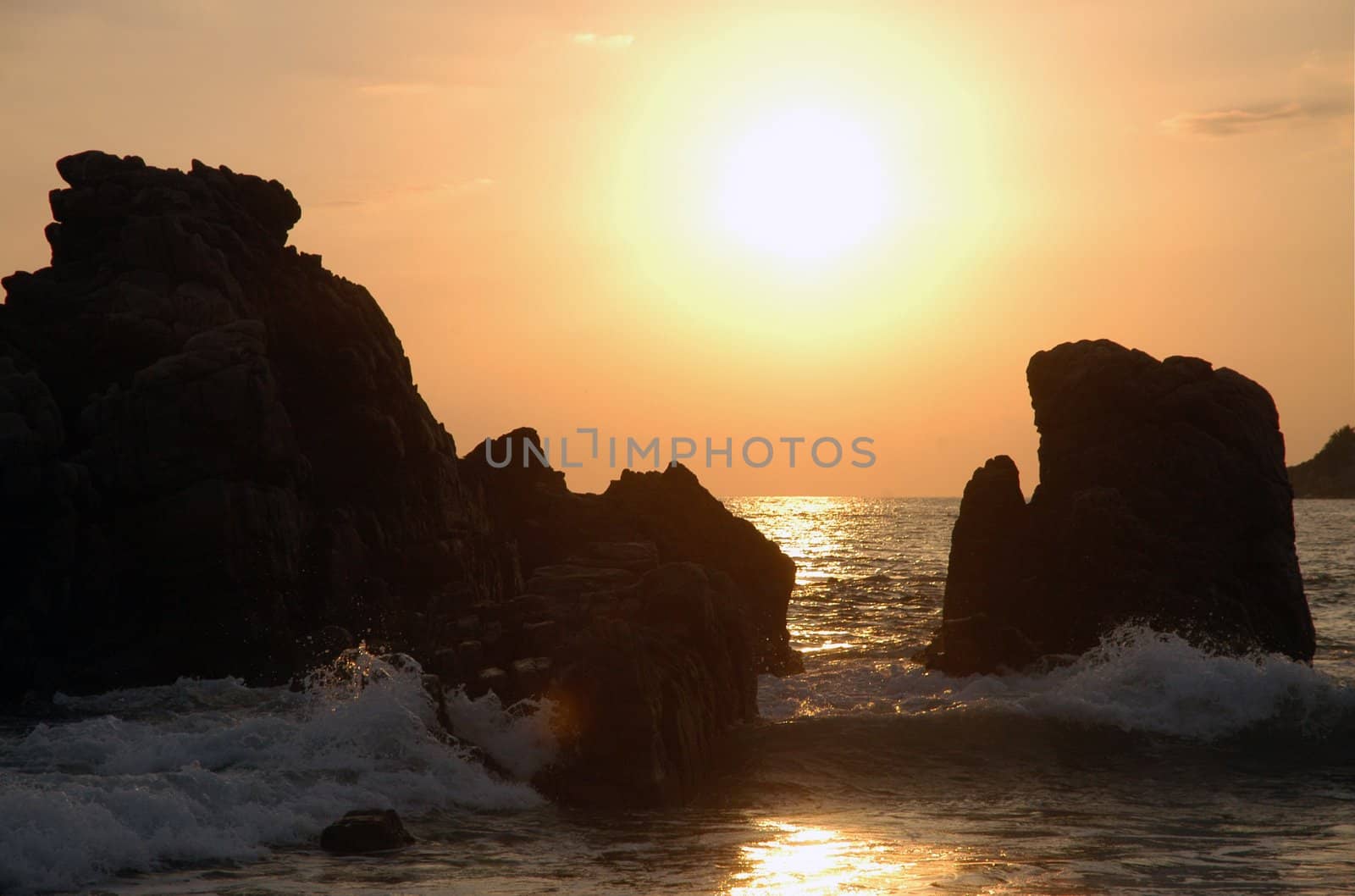 Silhouette of monument during sunset over the beach of Puerto Escondido
